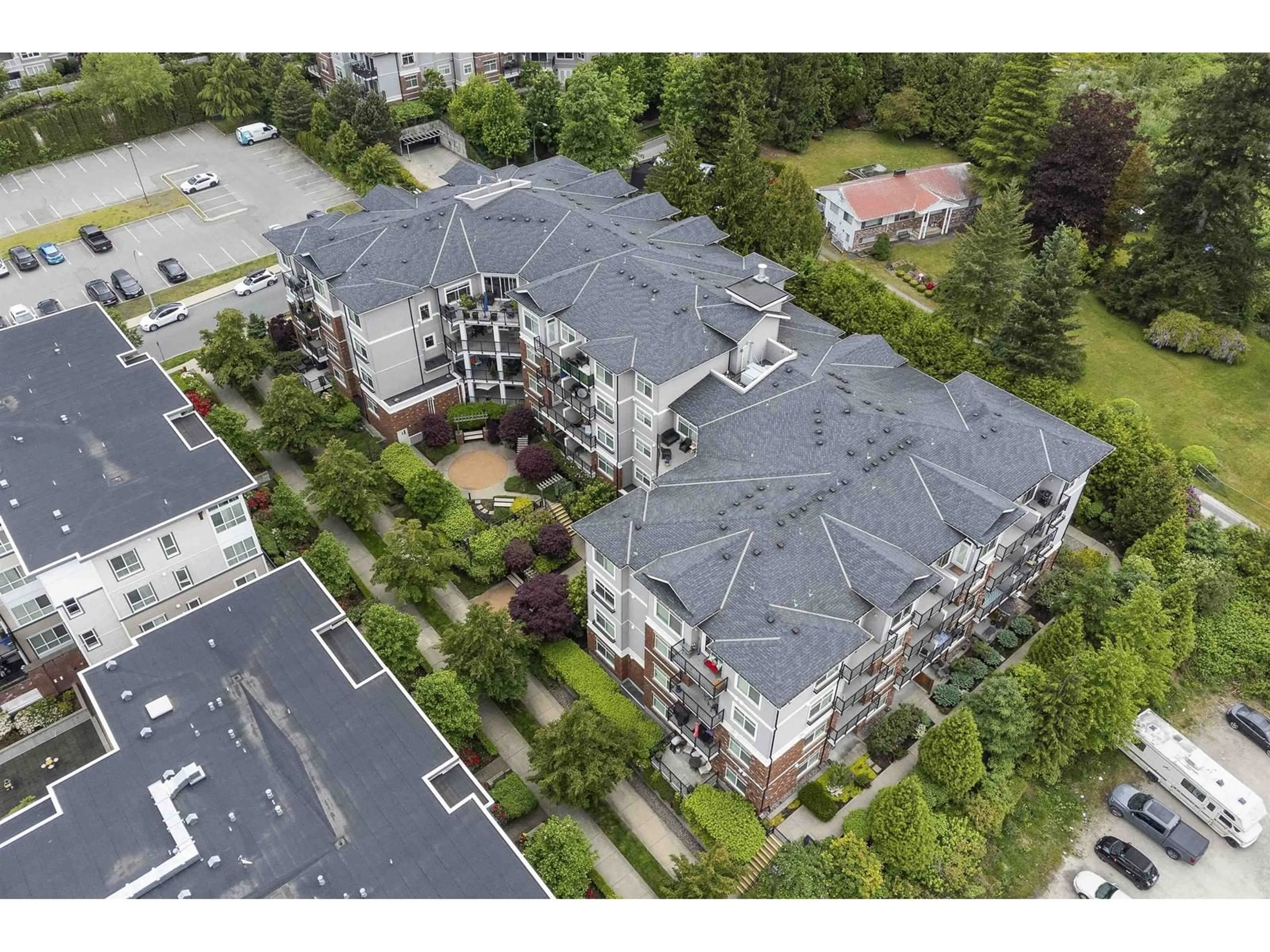A pic from outside/outdoor area/front of a property/back of a property/a pic from drone, unknown for 103 - 6480 195A, Surrey British Columbia V4N6P1