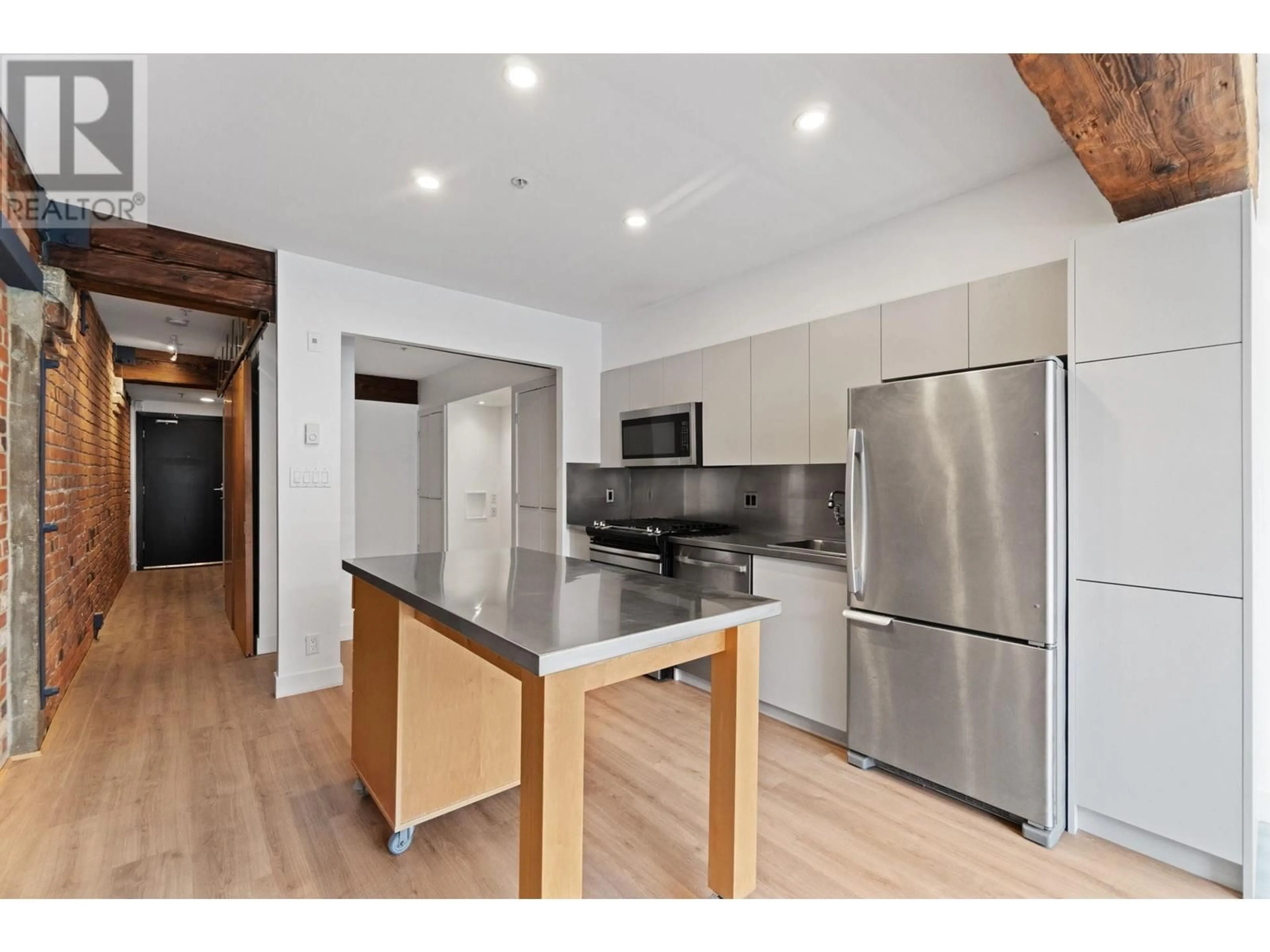 Open concept kitchen, wood/laminate floor for 308 - 1072 HAMILTON STREET, Vancouver British Columbia V6B2R9