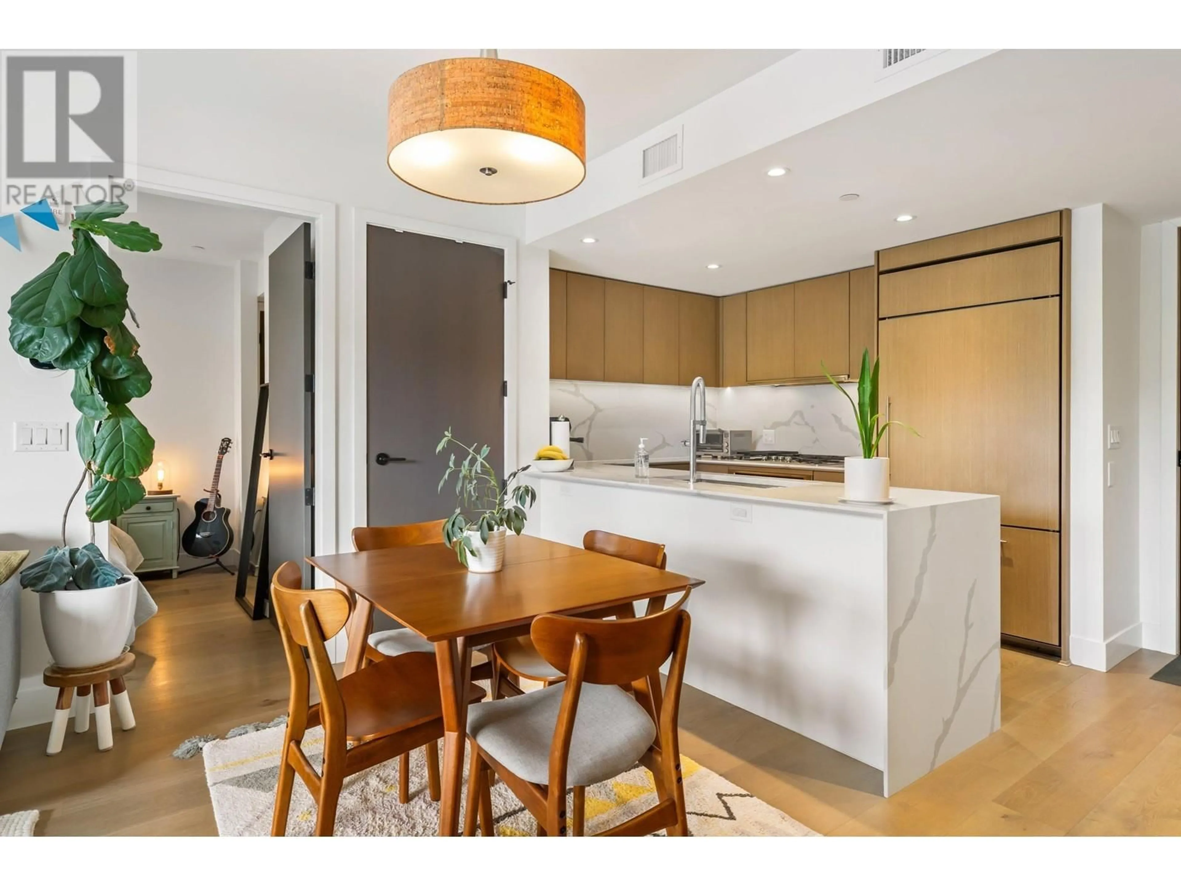 Open concept kitchen, wood/laminate floor for 201 - 5089 QUEBEC STREET, Vancouver British Columbia V5W0E5
