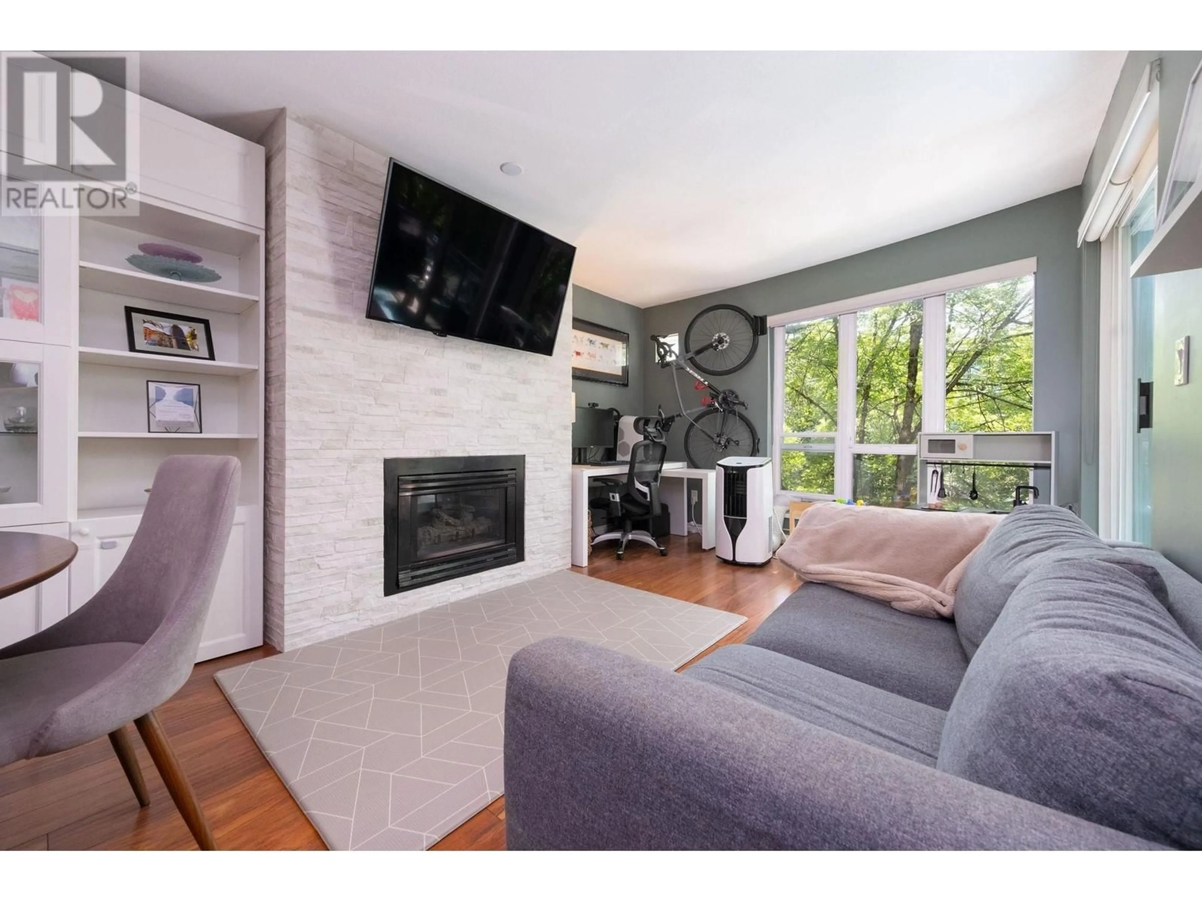 Living room with furniture, wood/laminate floor for 307 - 2437 WELCHER AVENUE, Port Coquitlam British Columbia V3C1X8