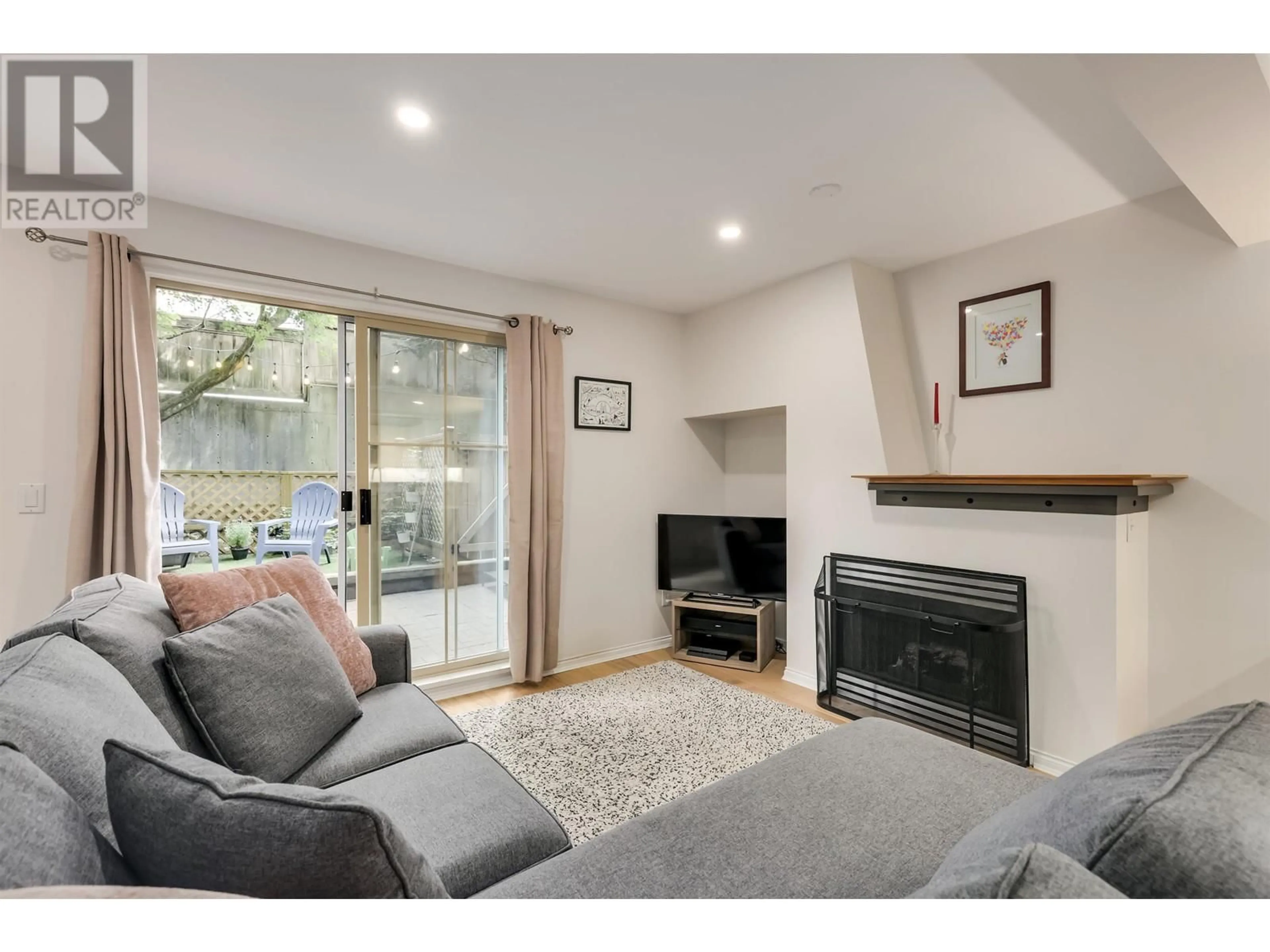 Living room with furniture, wood/laminate floor for 12 - 2375 BROADWAY, Vancouver British Columbia V6K2E6