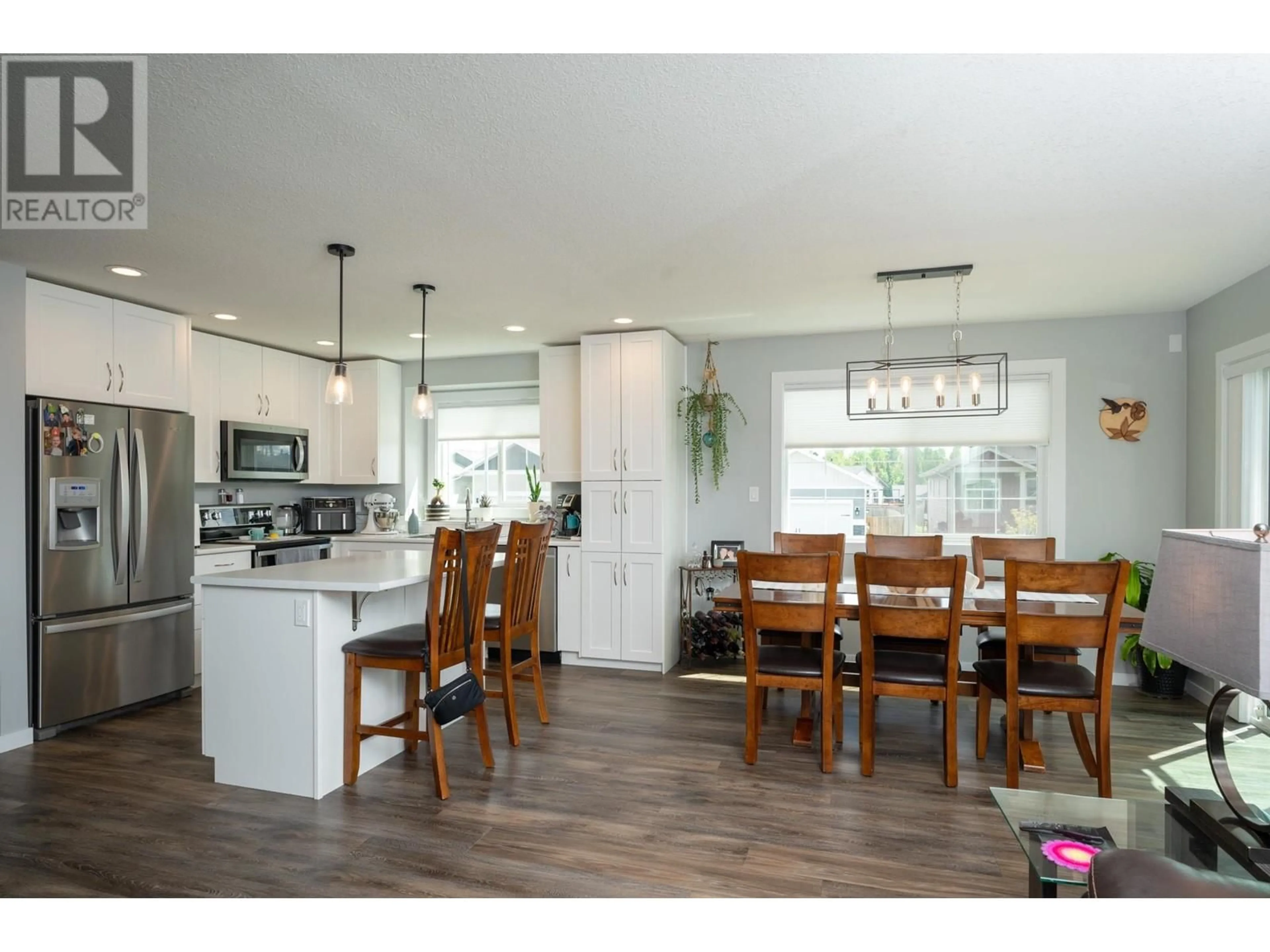 Open concept kitchen, wood/laminate floor for 9035 TATLOW PLACE, Prince George British Columbia V2K0B5