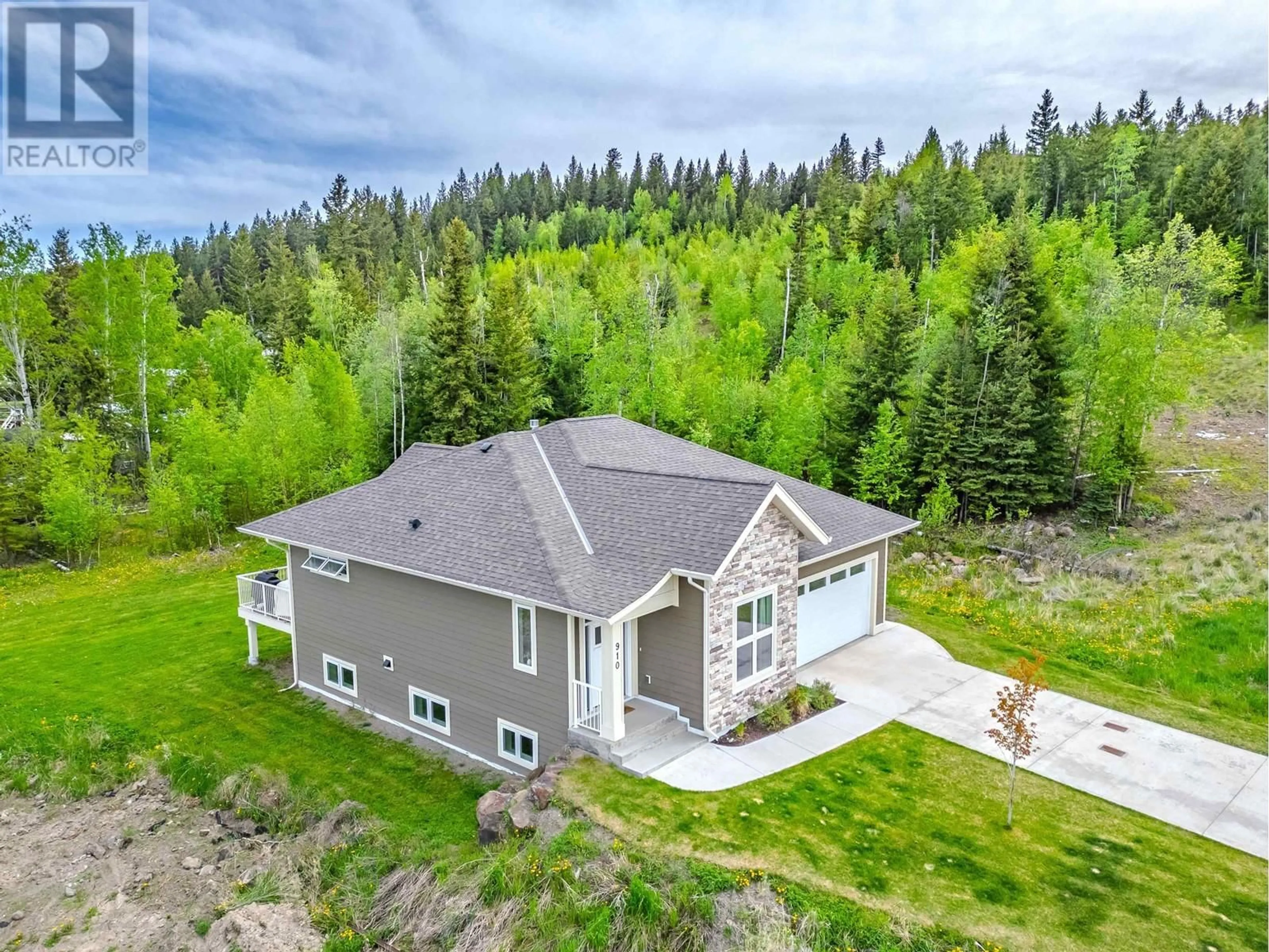A pic from outside/outdoor area/front of a property/back of a property/a pic from drone, forest/trees view for 910 SPRUCE PLACE, 100 Mile House British Columbia V0K2E0