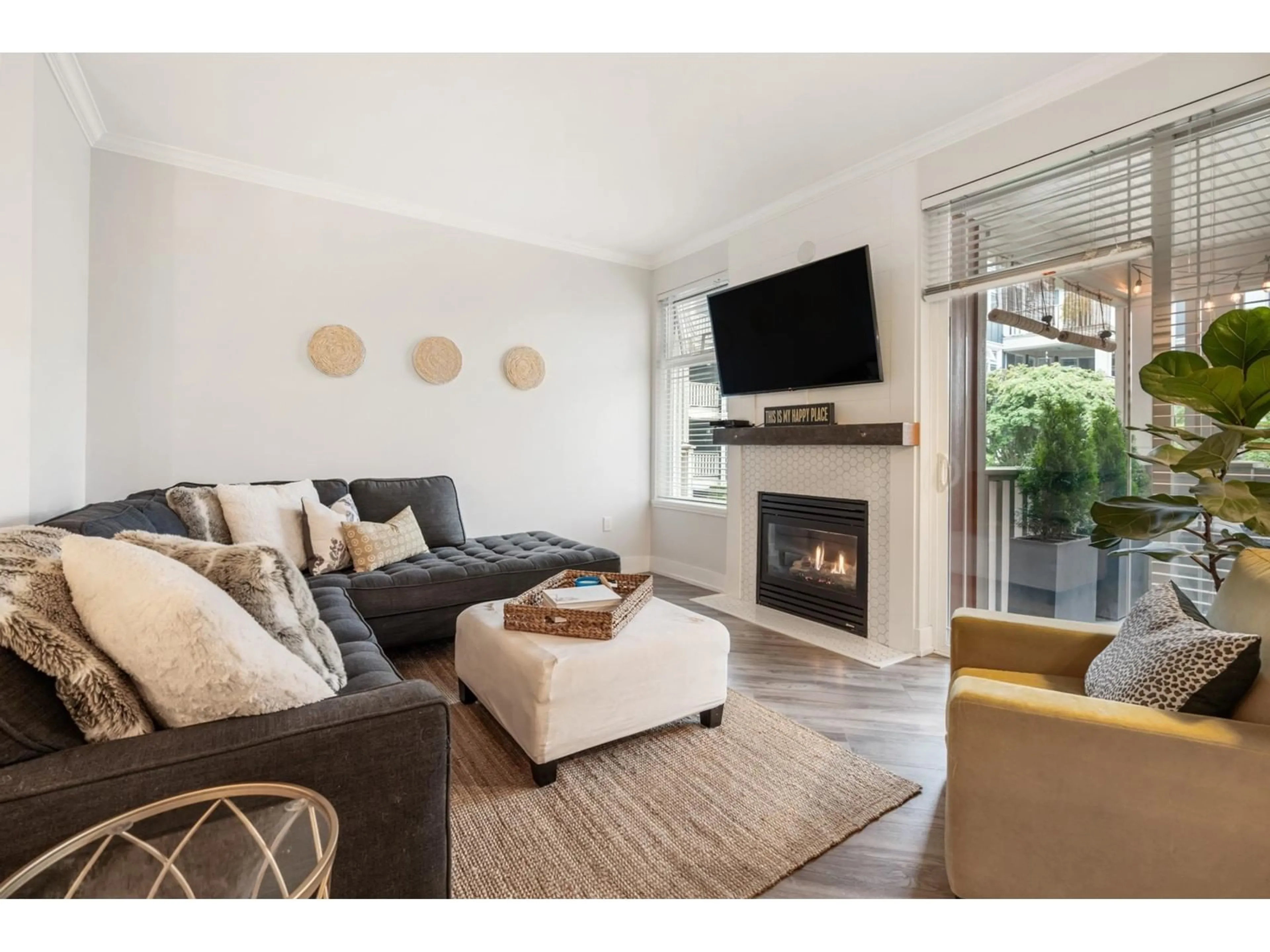 Living room with furniture, wood/laminate floor for 209 - 15368 16A, Surrey British Columbia V4A1S9