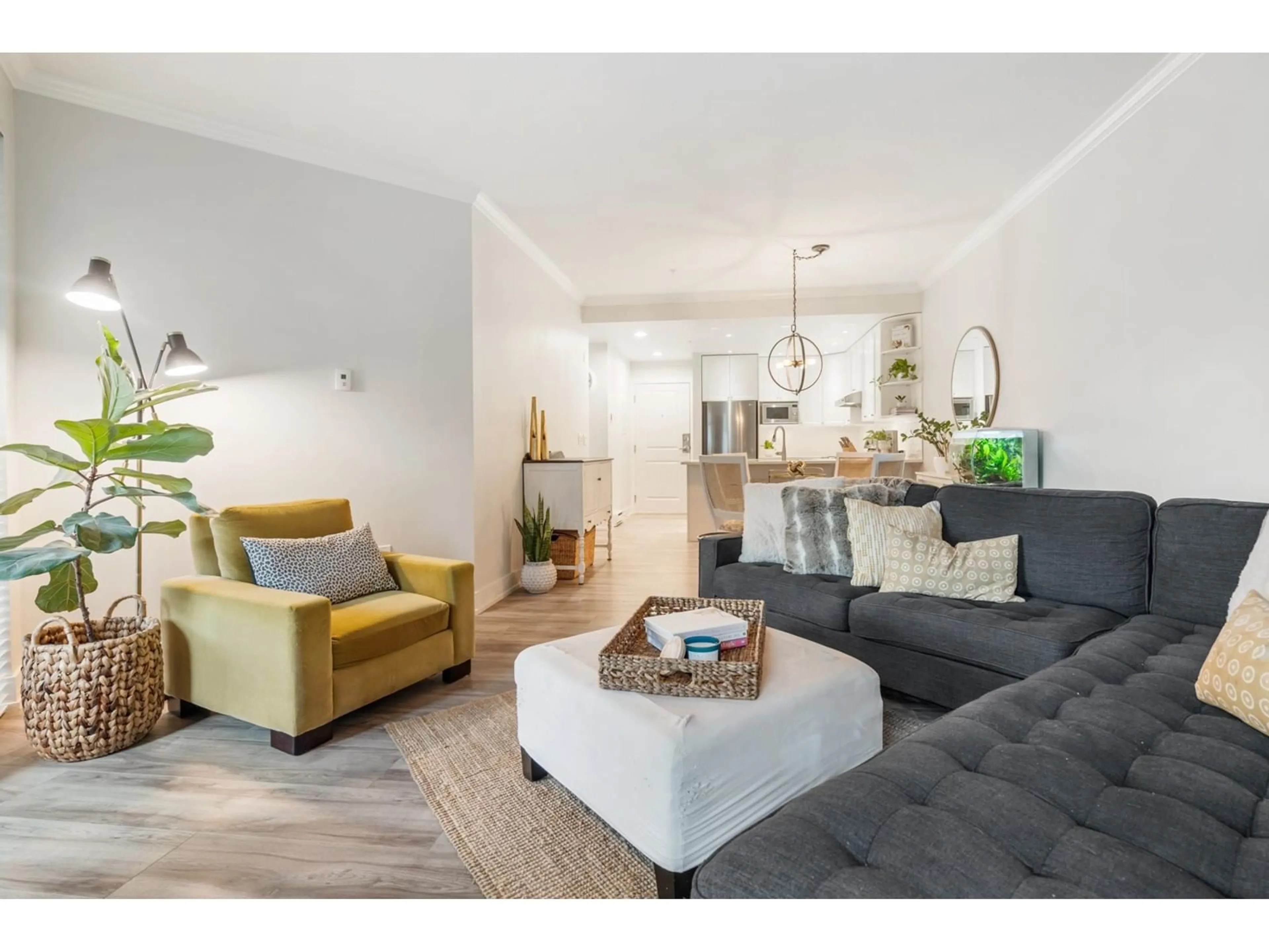 Living room with furniture, wood/laminate floor for 209 - 15368 16A, Surrey British Columbia V4A1S9