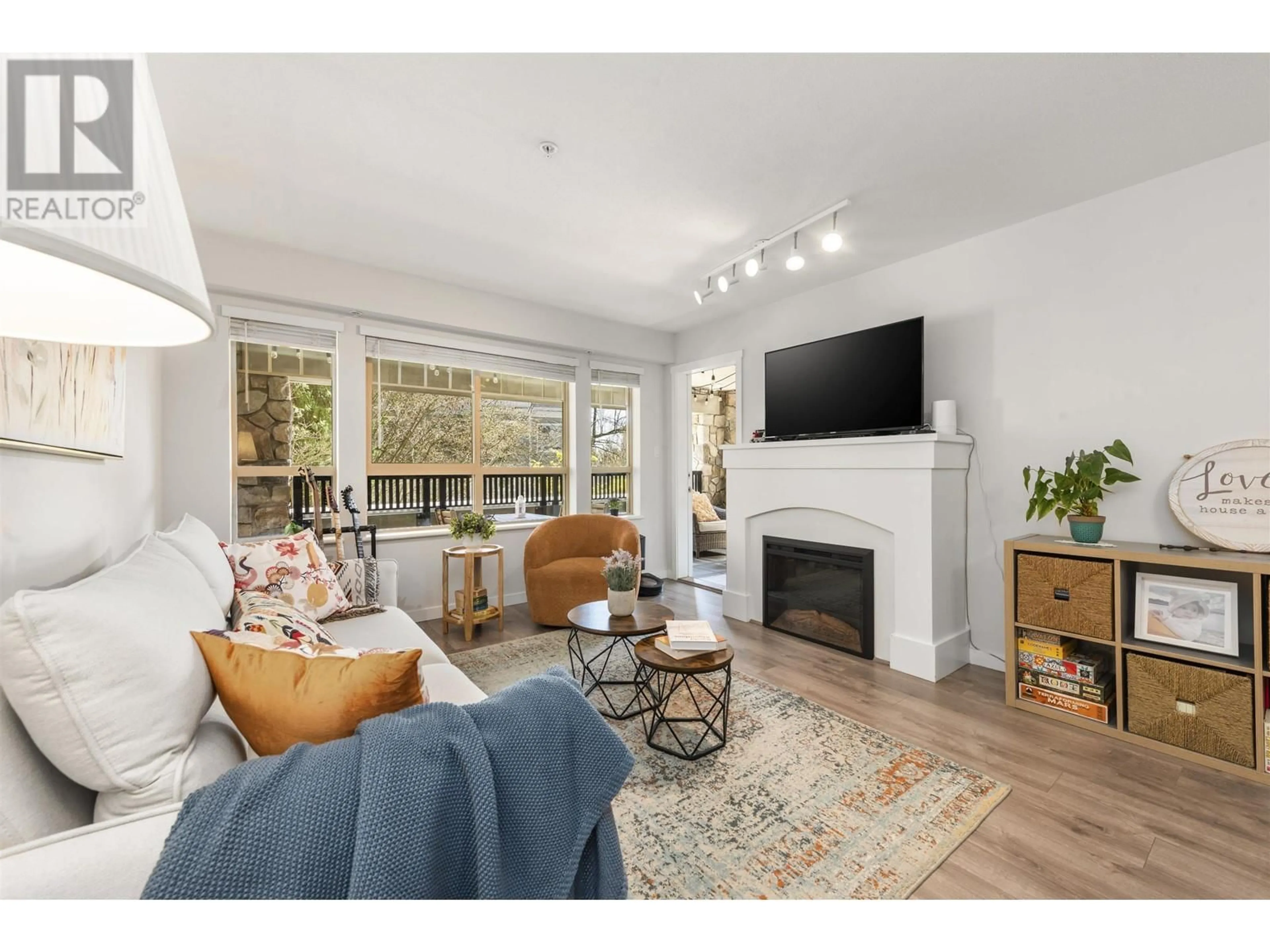 Living room with furniture, wood/laminate floor for 212 - 2959 SILVER SPRINGS BOULEVARD, Coquitlam British Columbia V3E3S5