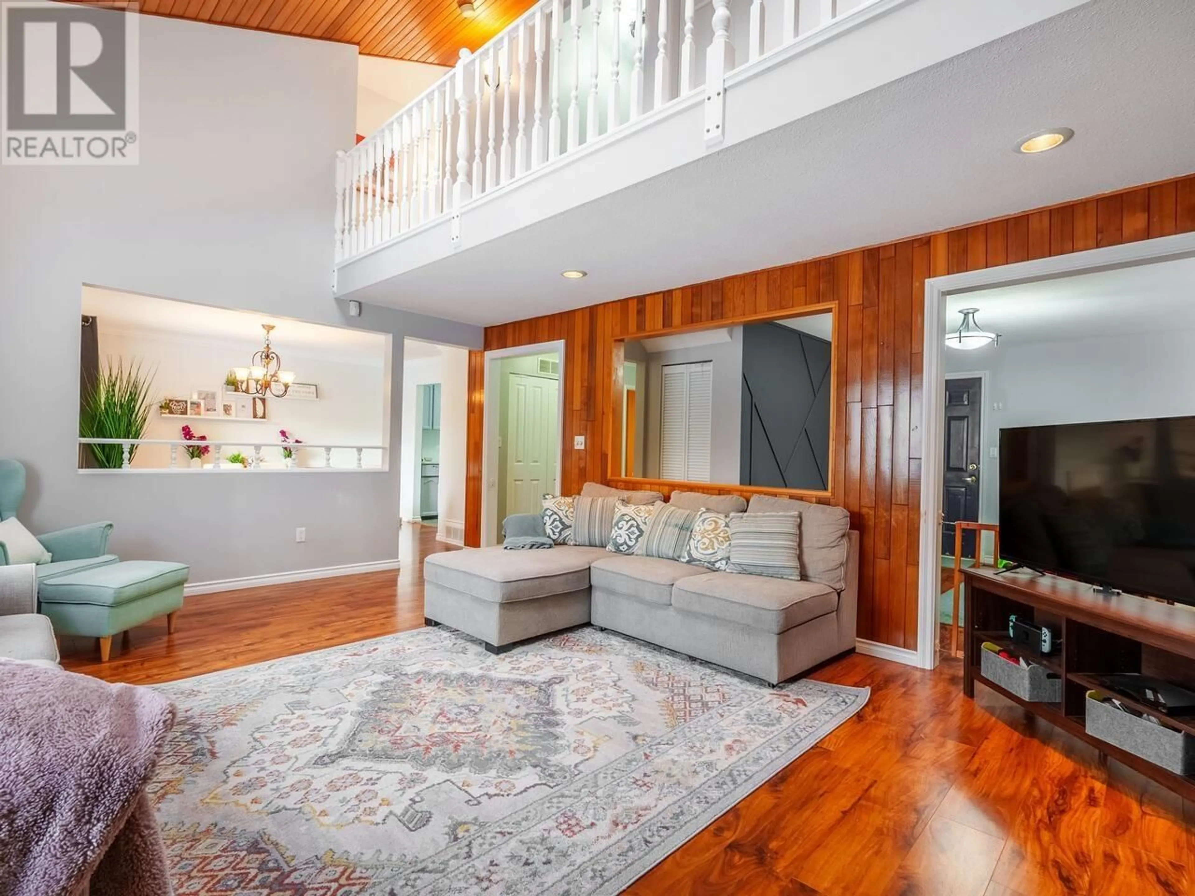Living room with furniture, wood/laminate floor for 1042 VICTORIA DRIVE, Port Coquitlam British Columbia V3B2T9