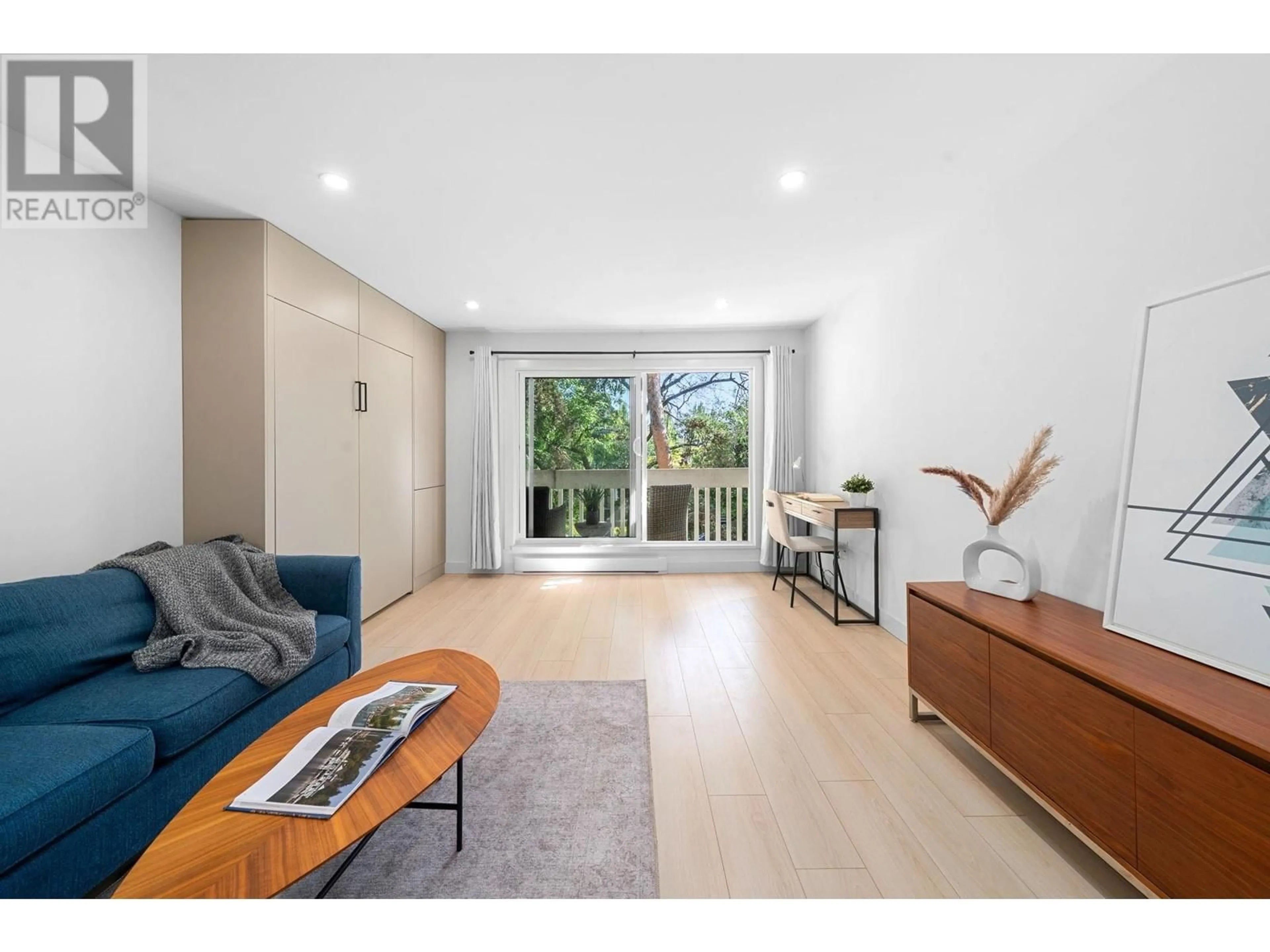 Living room with furniture, wood/laminate floor for 203 - 1545 2ND AVENUE, Vancouver British Columbia V5N1C8