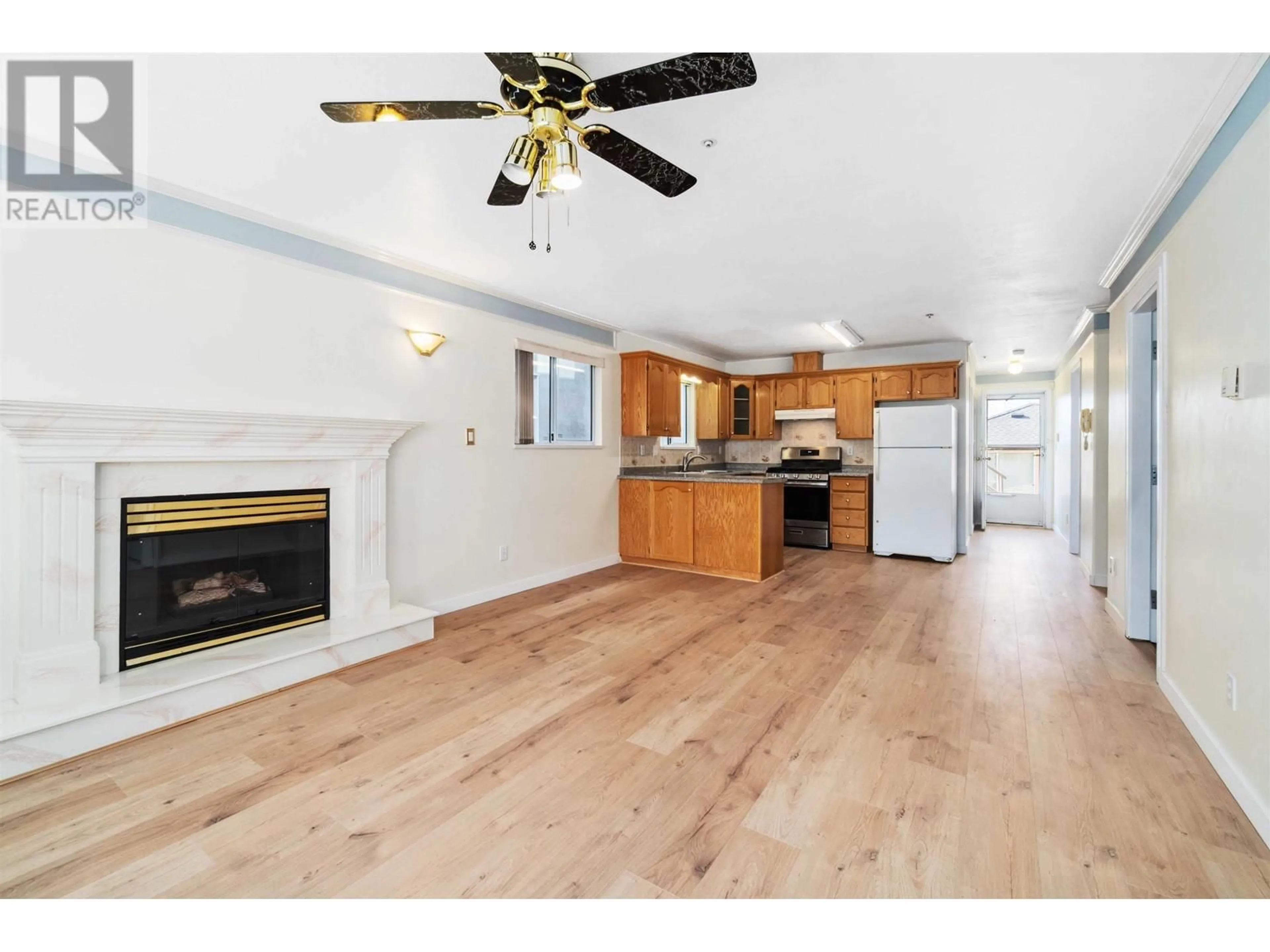 Open concept kitchen, wood/laminate floor for 362 56TH AVENUE, Vancouver British Columbia V5X1R3