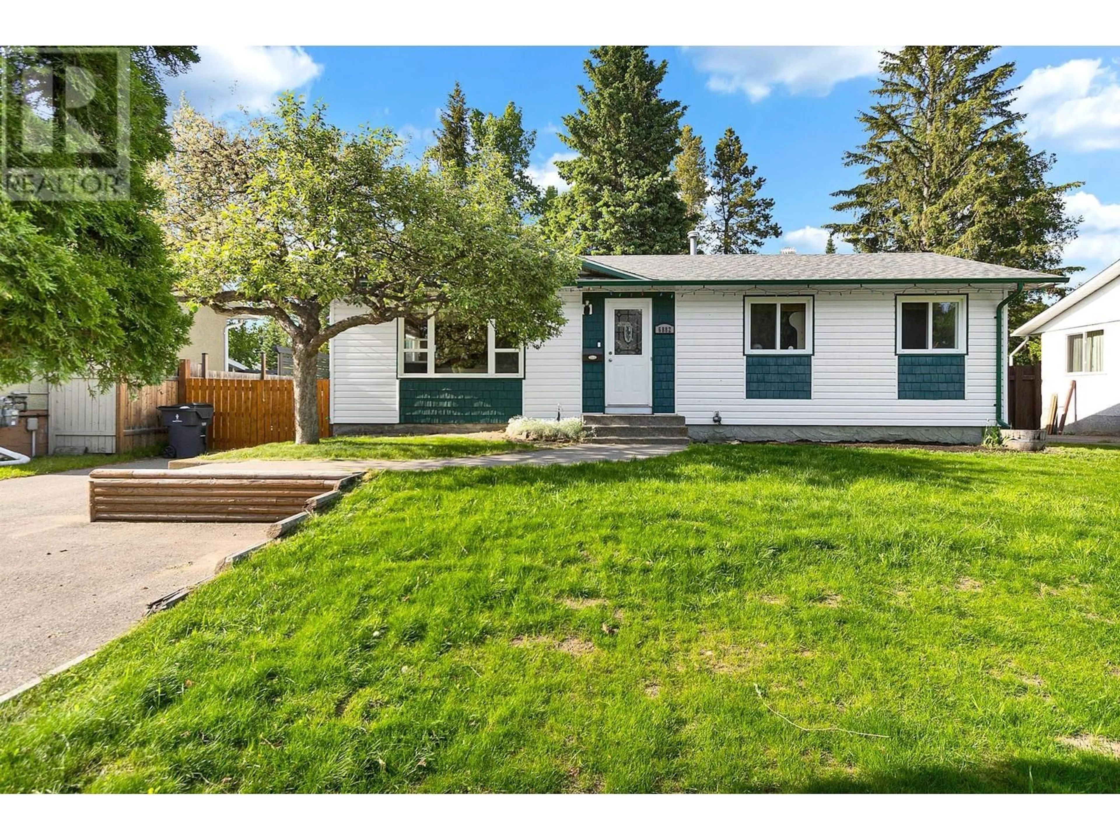 Home with vinyl exterior material, street for 6882 FAIRMONT CRESCENT, Prince George British Columbia V2N2P8