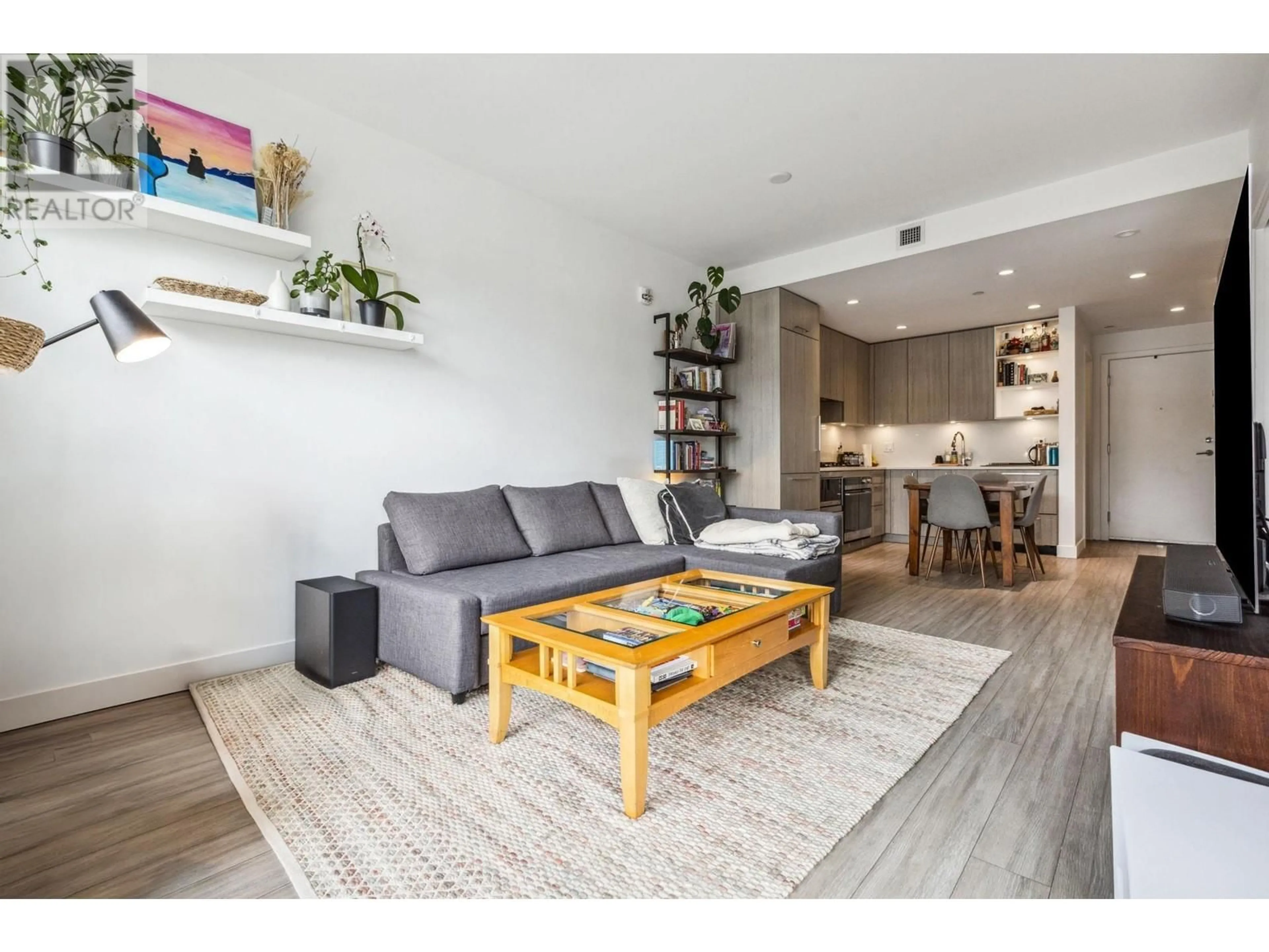 Living room with furniture, wood/laminate floor for 411 - 707 3RD STREET, North Vancouver British Columbia V7L1G8