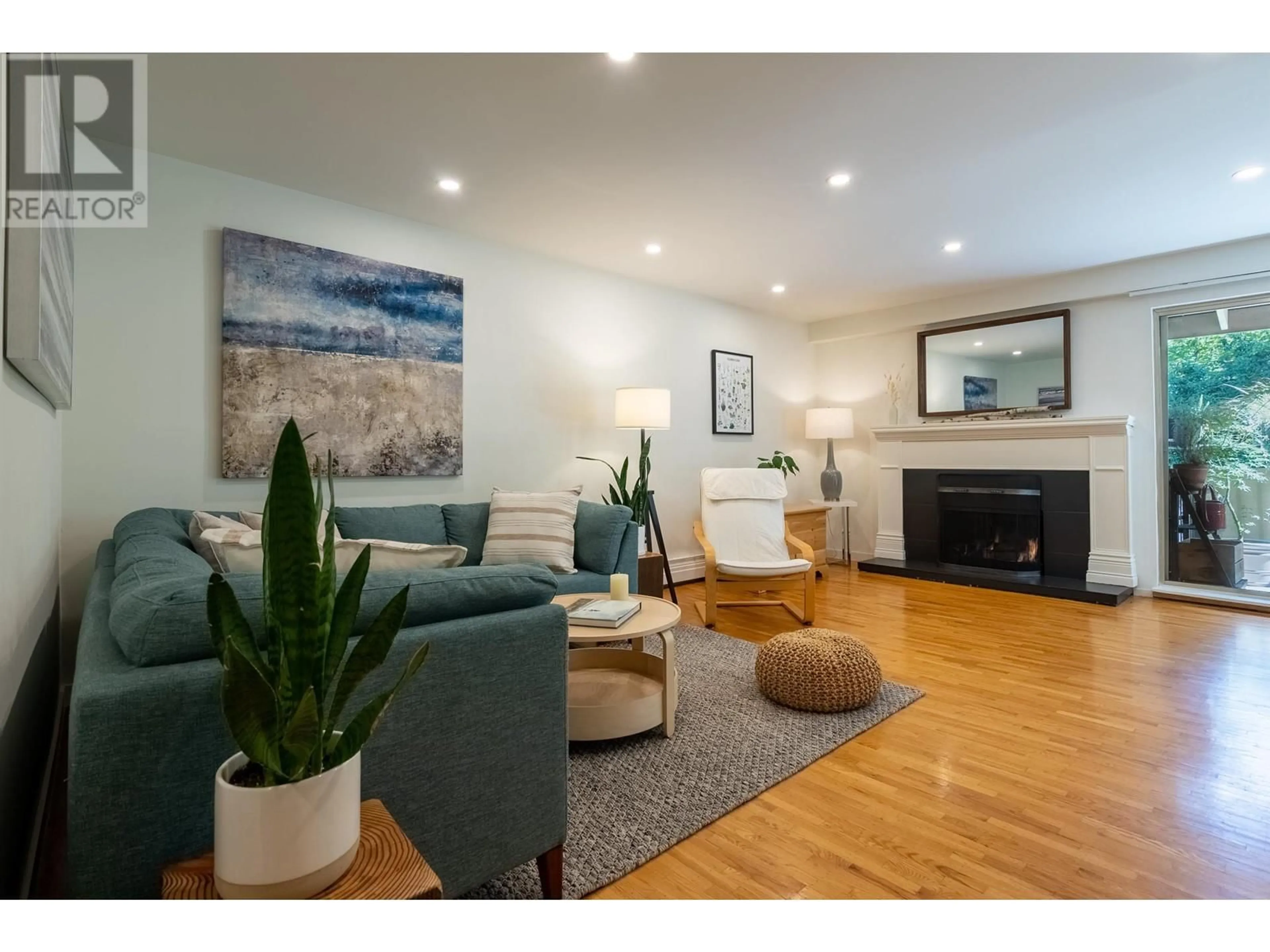 Living room with furniture, wood/laminate floor for 316 - 555 28TH STREET, North Vancouver British Columbia V7N2J7