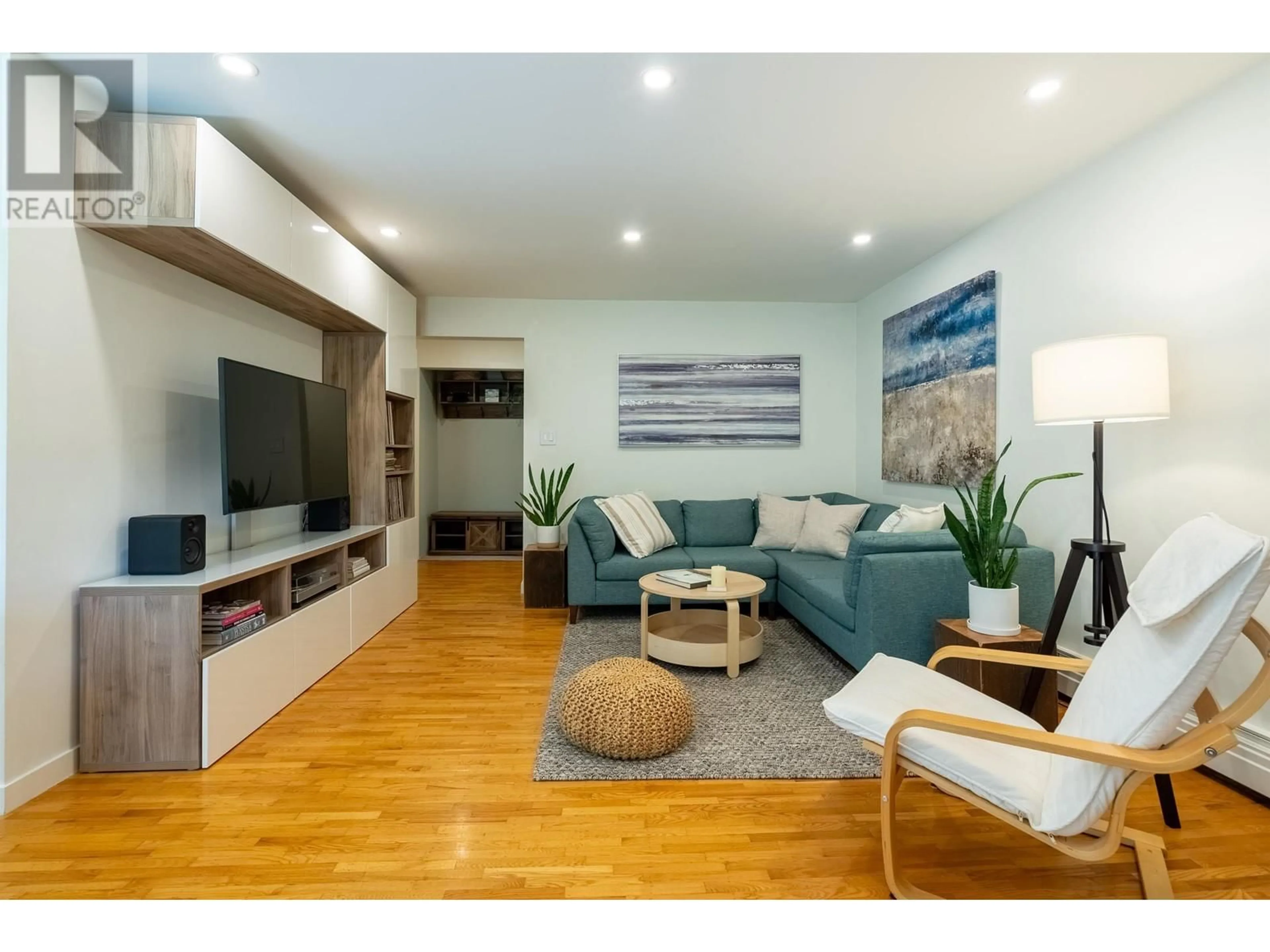 Living room with furniture, wood/laminate floor for 316 - 555 28TH STREET, North Vancouver British Columbia V7N2J7