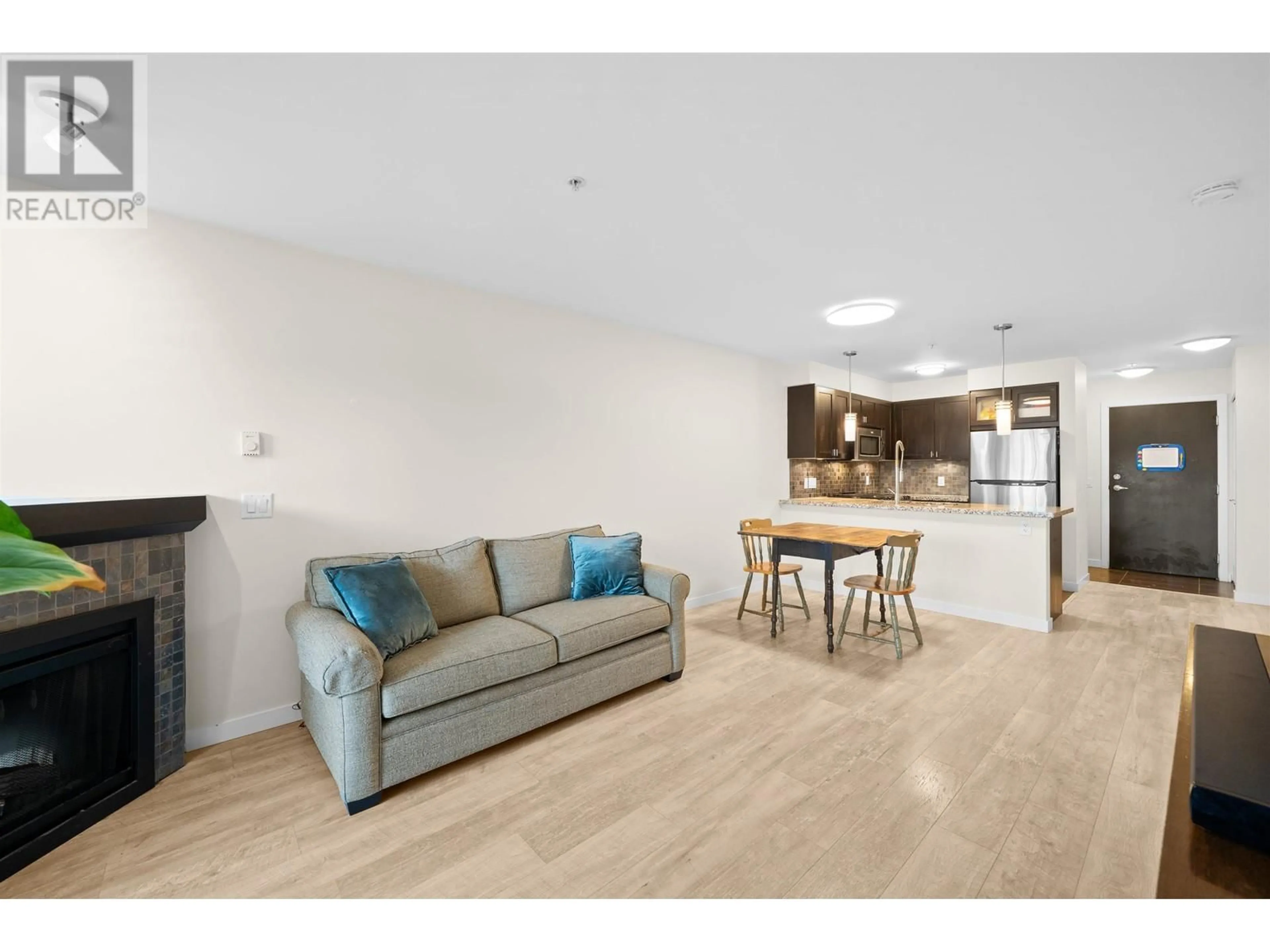 Living room with furniture, wood/laminate floor for 202 - 405 SKEENA STREET, Vancouver British Columbia V5K0A3