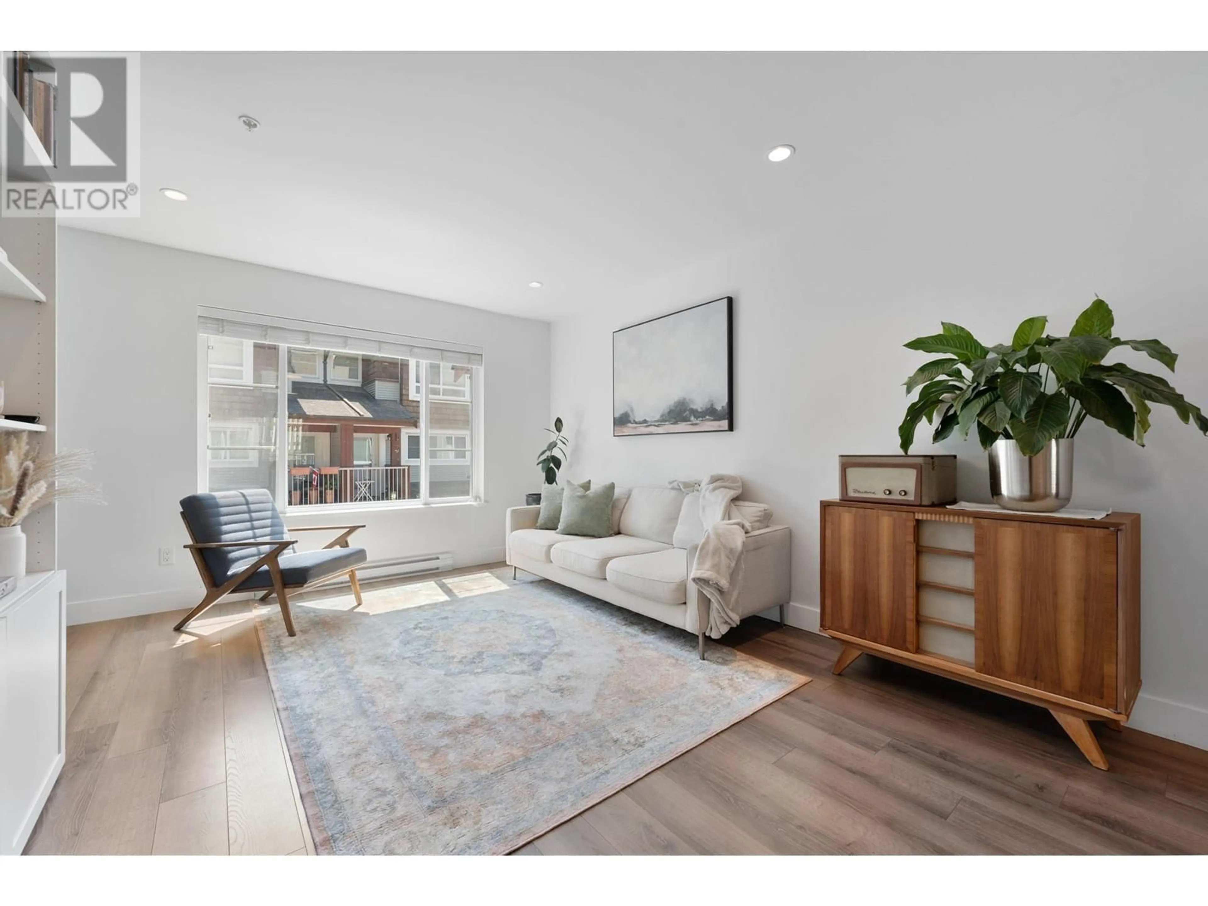 Living room with furniture, wood/laminate floor for 45 - 23651 132 AVENUE, Maple Ridge British Columbia V4R0E9
