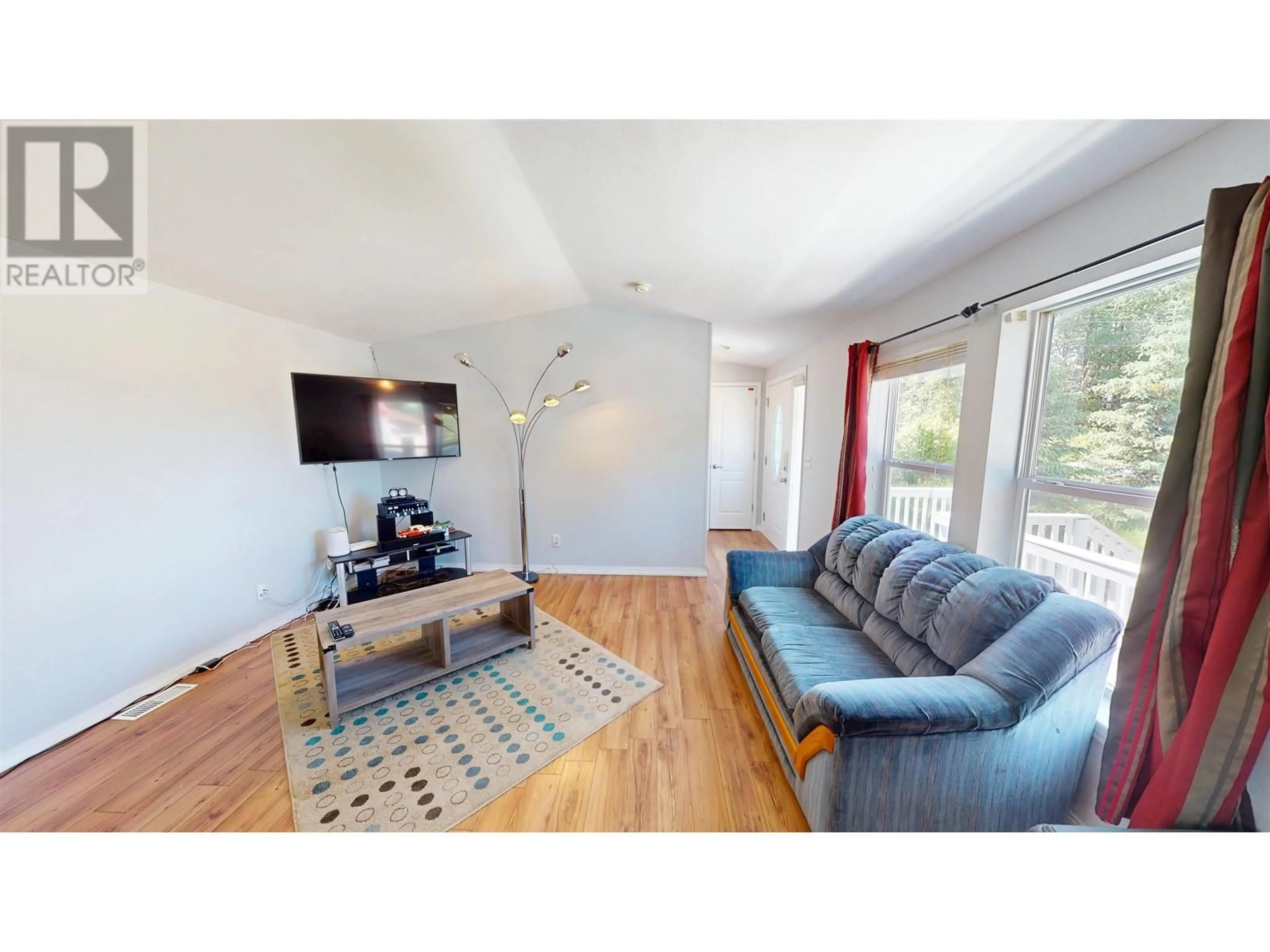 Living room with furniture, wood/laminate floor for 3688 TREMBLEY ROAD, Quesnel British Columbia V2J6S5