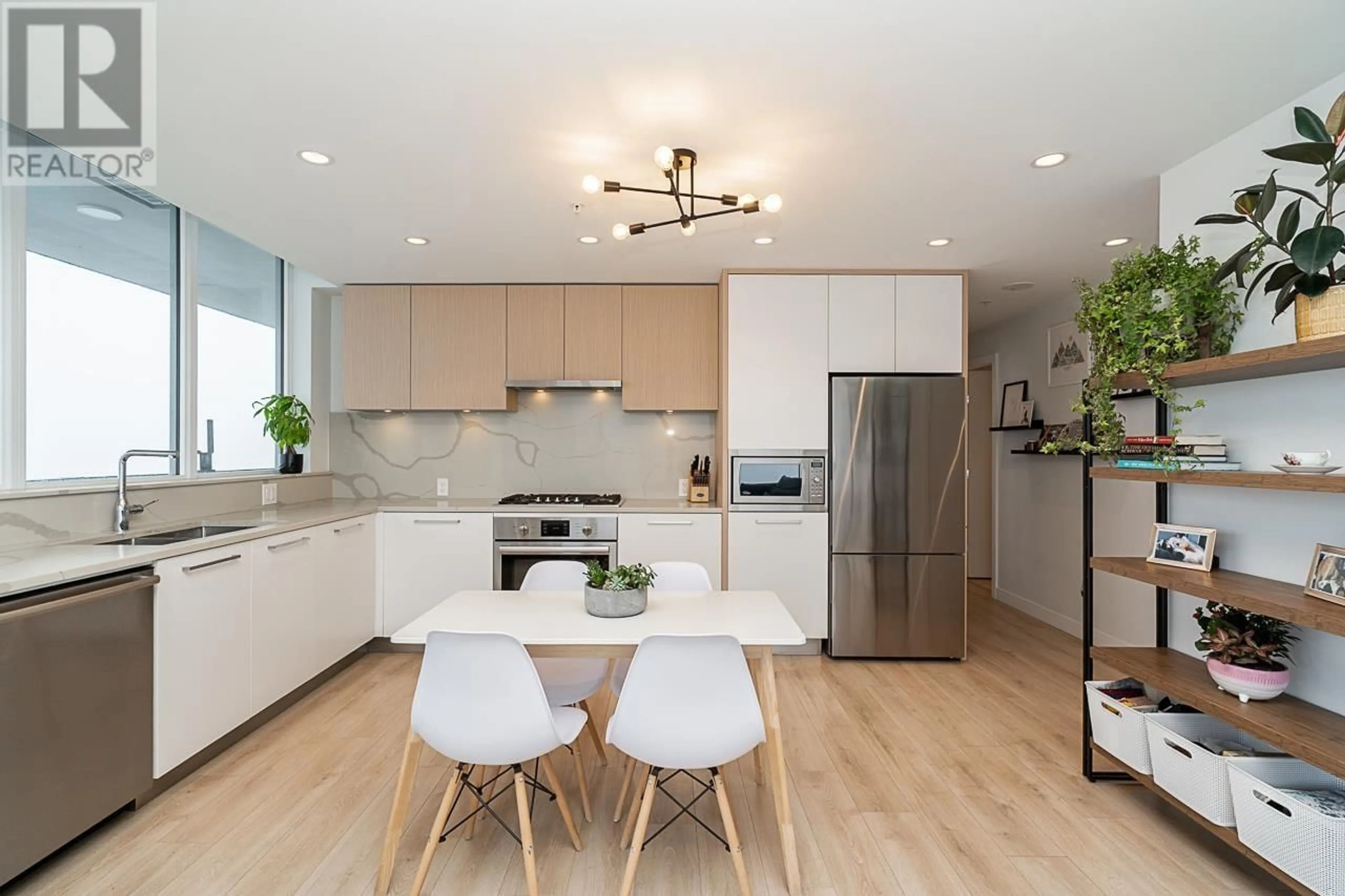 Open concept kitchen, wood/laminate floor for 2704 - 567 CLARKE ROAD, Coquitlam British Columbia V3J0K7