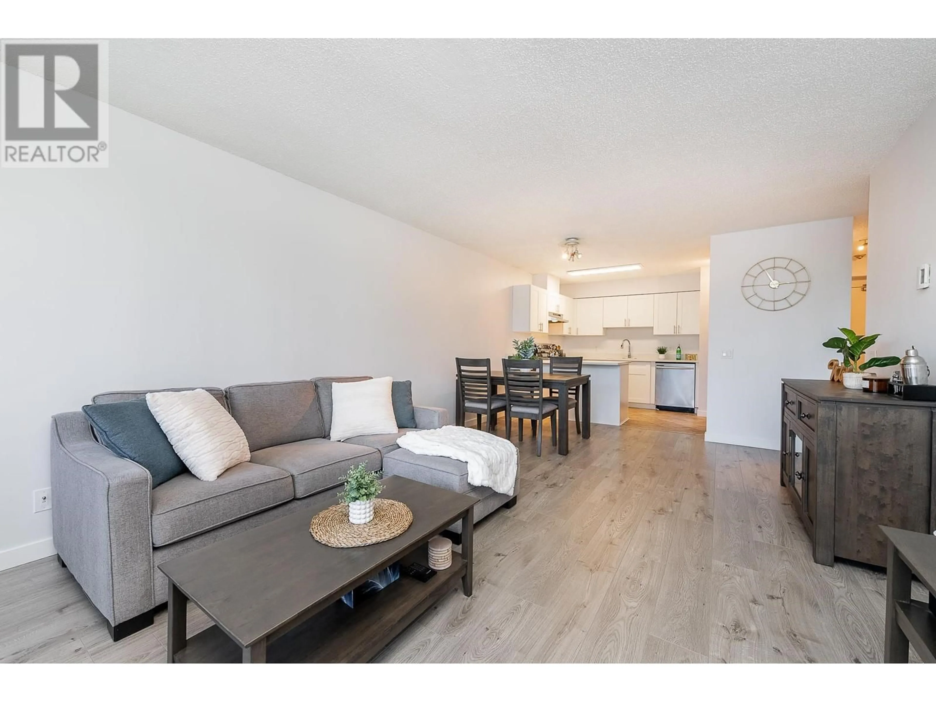 Living room with furniture, wood/laminate floor for 605 - 3970 CARRIGAN COURT, Burnaby British Columbia V3N4S5