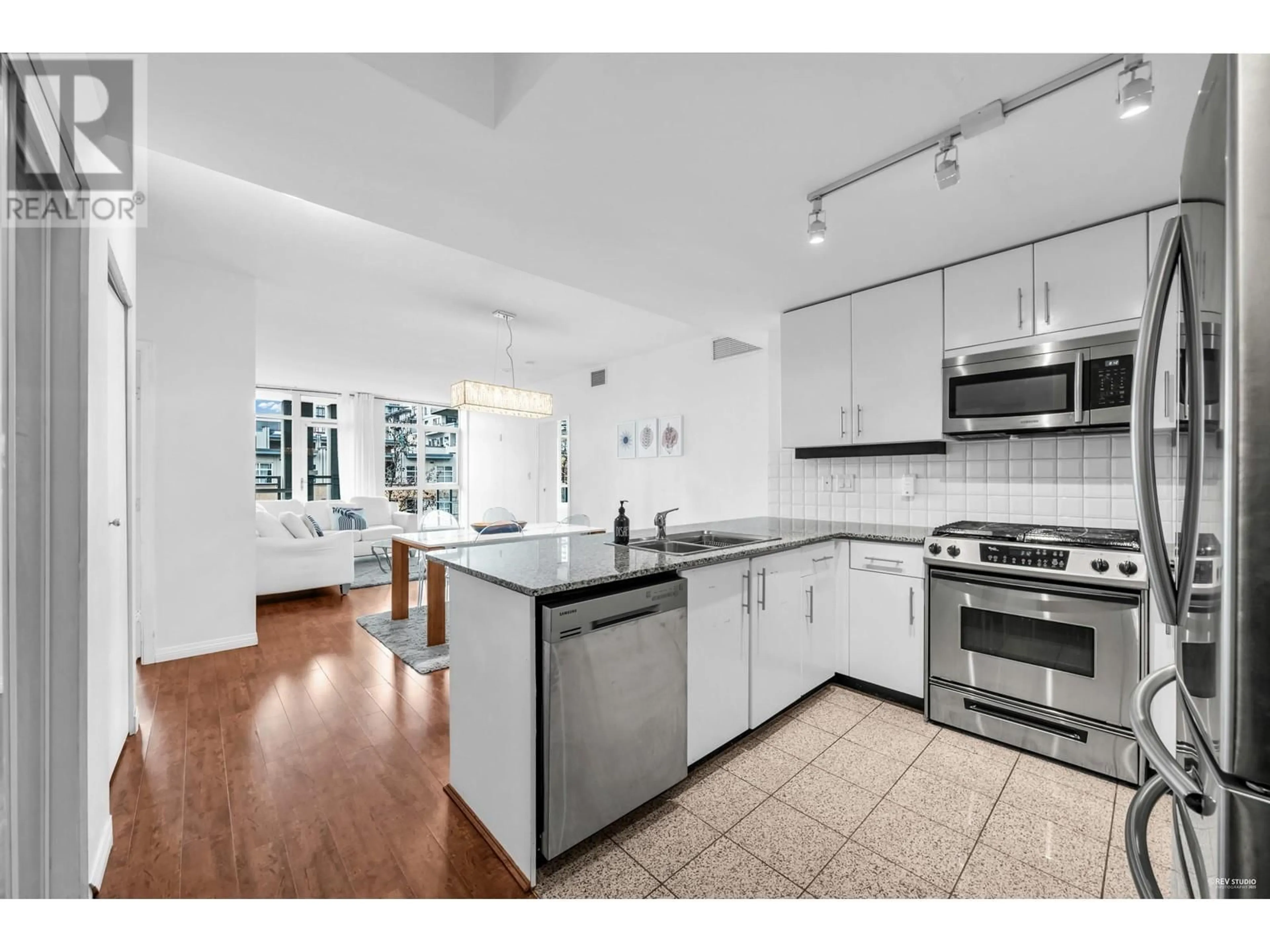 Open concept kitchen, ceramic/tile floor for 409 - 100 ESPLANADE STREET, North Vancouver British Columbia V7L4V1