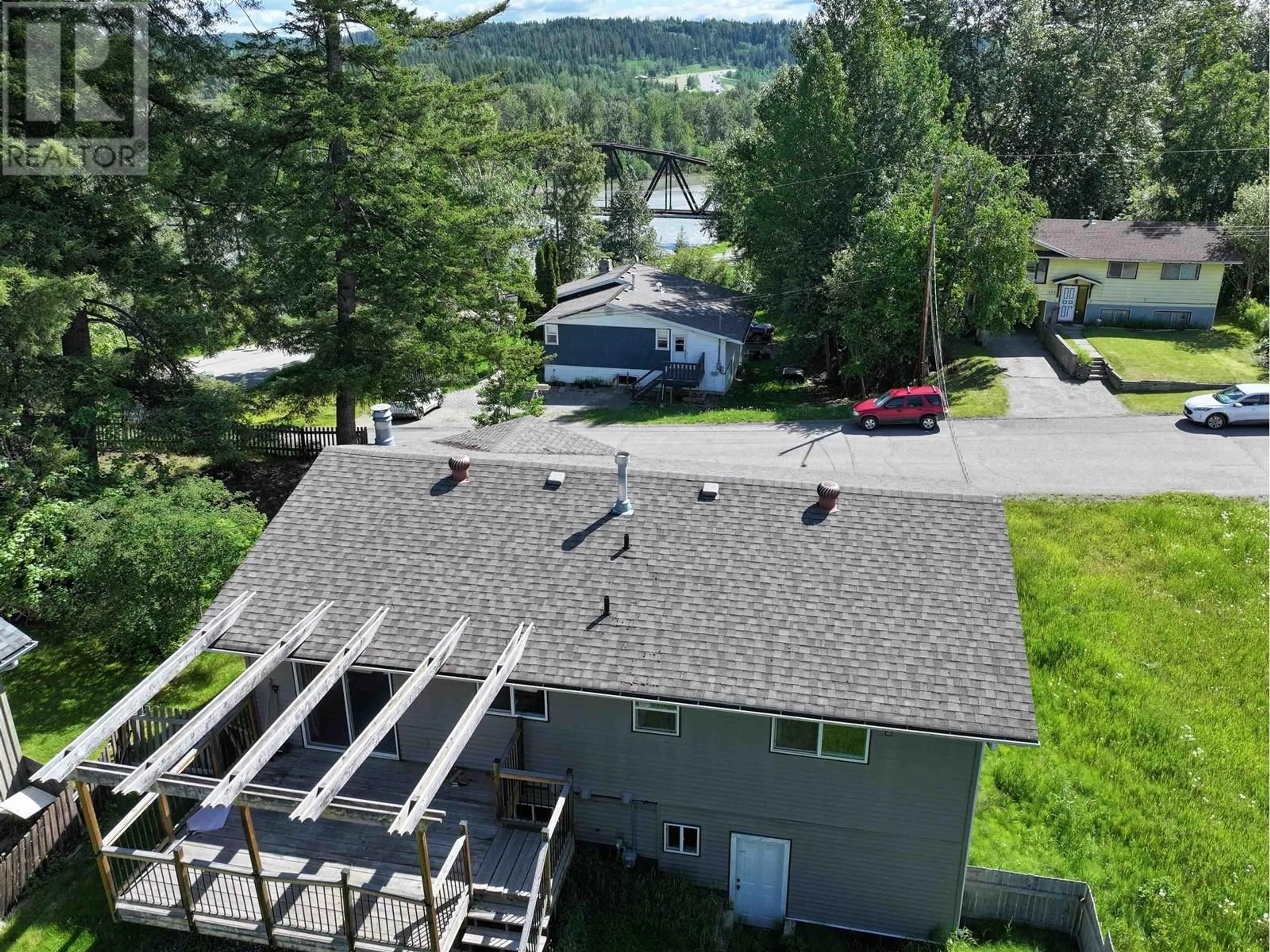 A pic from outside/outdoor area/front of a property/back of a property/a pic from drone, water/lake/river/ocean view for 679 JONES STREET, Quesnel British Columbia V2J2X3