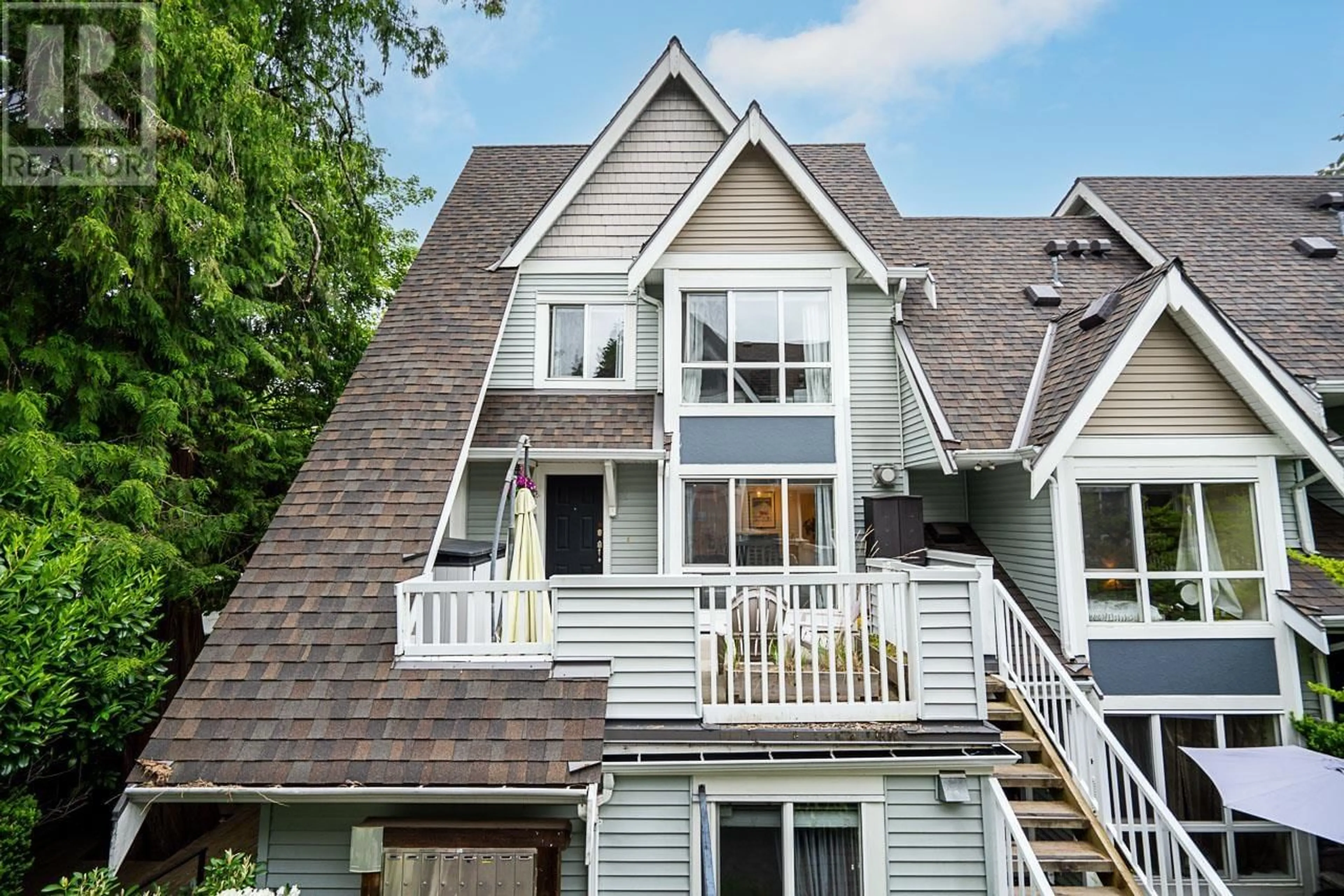 Home with vinyl exterior material, mountain view for 2 - 1027 LYNN VALLEY ROAD, North Vancouver British Columbia V7J1Z6