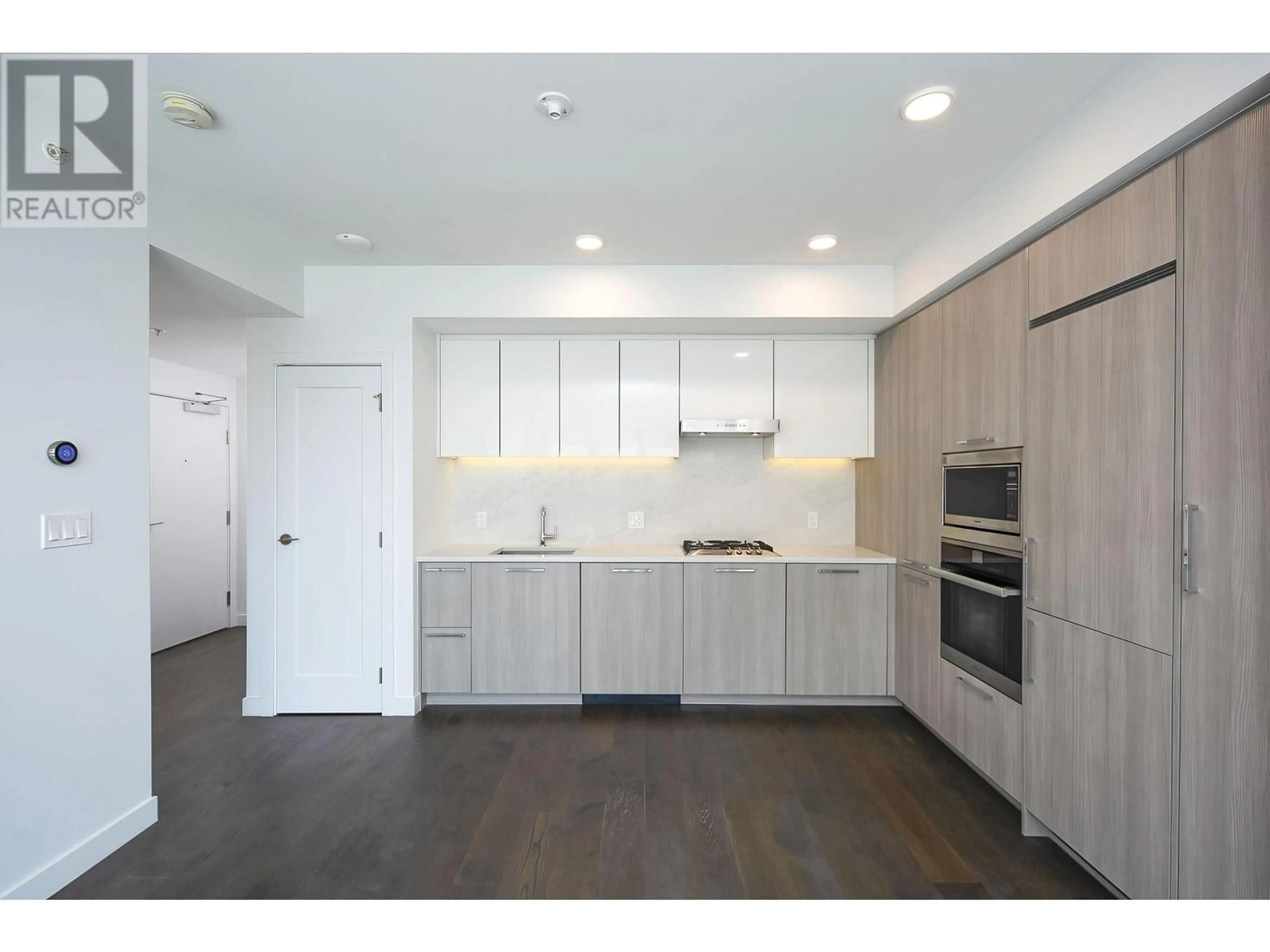 Open concept kitchen, wood/laminate floor for 1103 - 3200 CORVETTE WAY, Richmond British Columbia V6X0T8