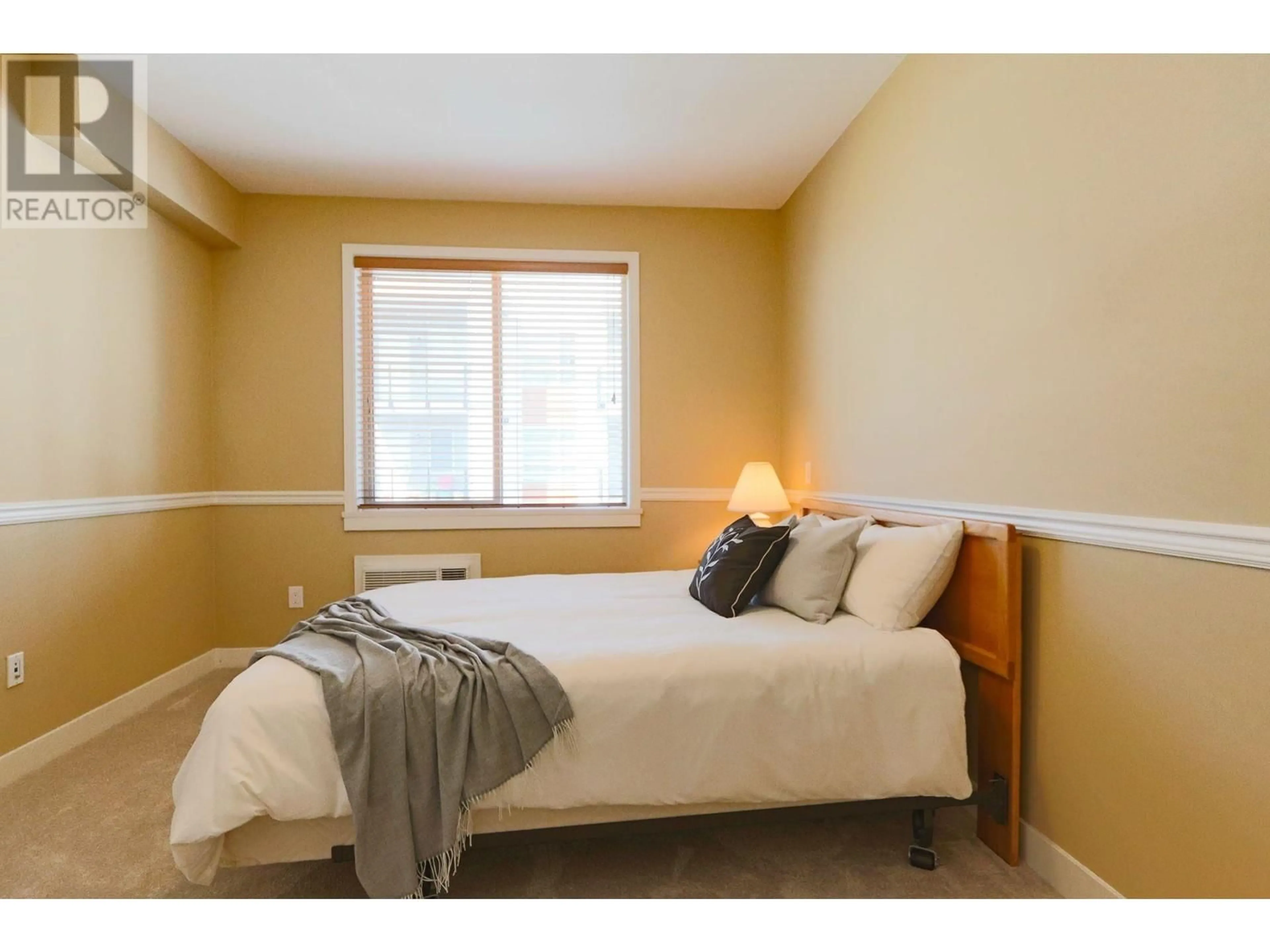 Bedroom with bed, wood/laminate floor for 413 - 11887 BURNETT STREET, Maple Ridge British Columbia V2X6P6