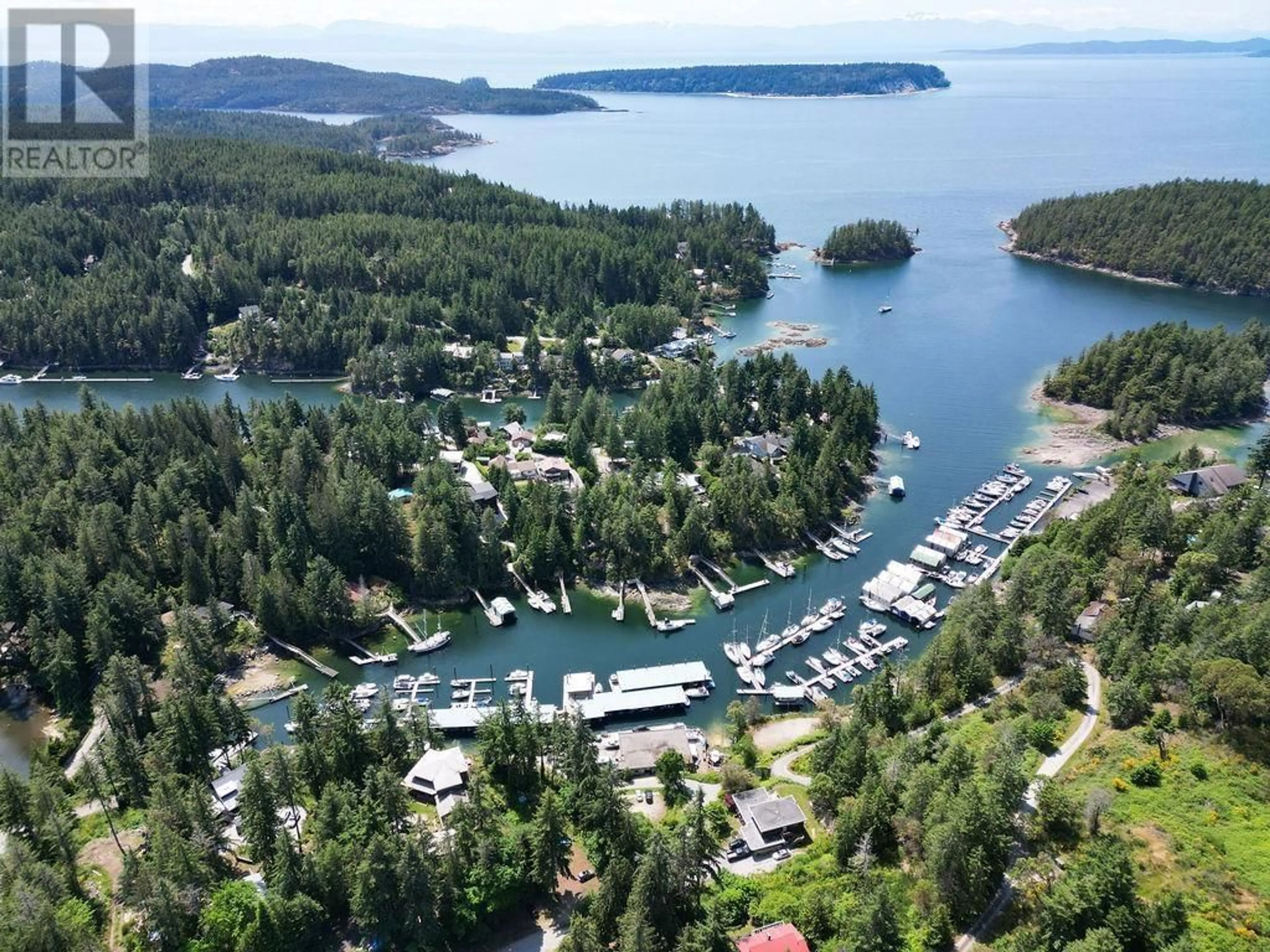 A pic from outside/outdoor area/front of a property/back of a property/a pic from drone, water/lake/river/ocean view for 5549 SANS SOUCI ROAD, Halfmoon Bay British Columbia V7Z1B6
