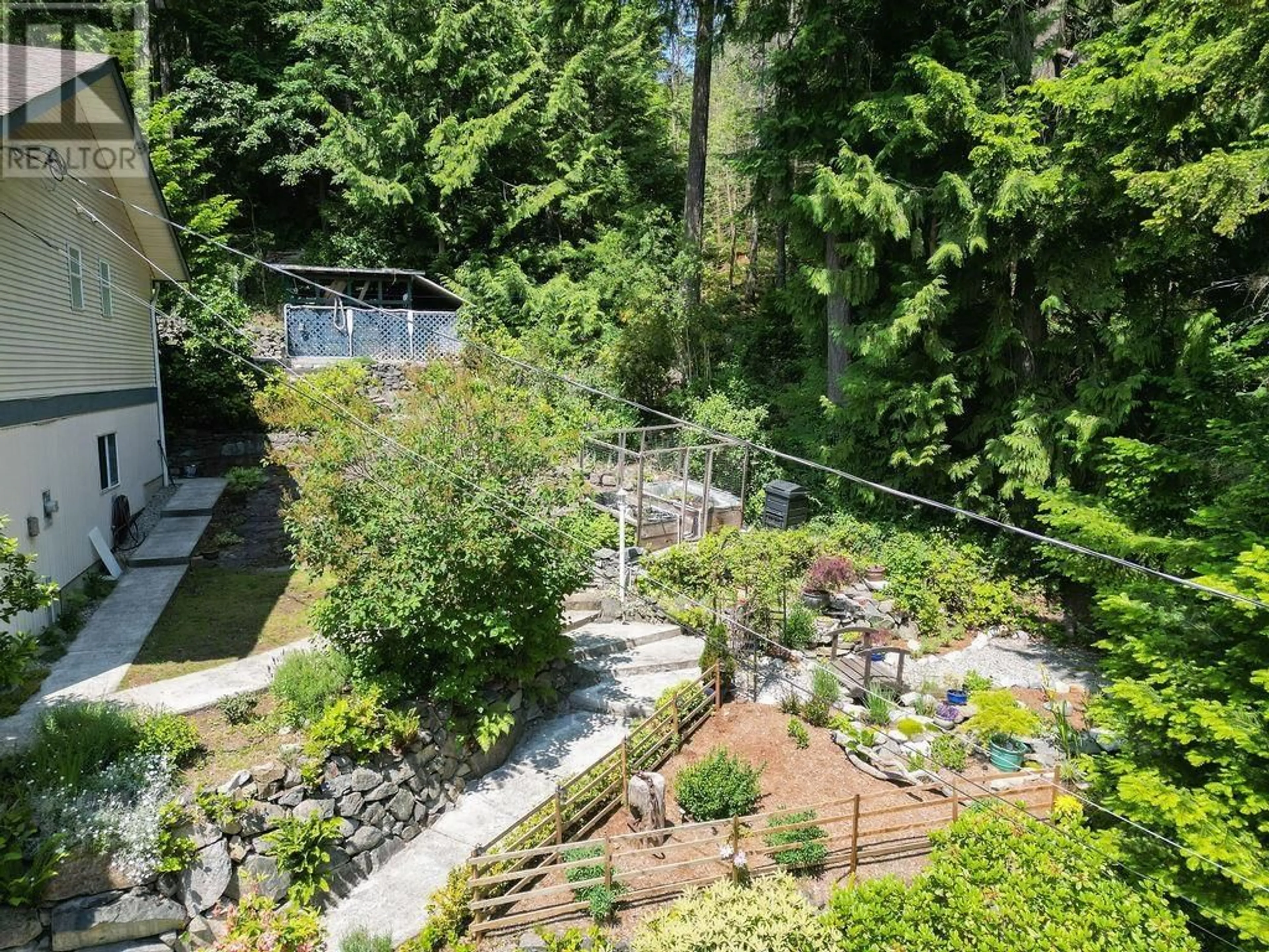 A pic from outside/outdoor area/front of a property/back of a property/a pic from drone, forest/trees view for 5549 SANS SOUCI ROAD, Halfmoon Bay British Columbia V7Z1B6