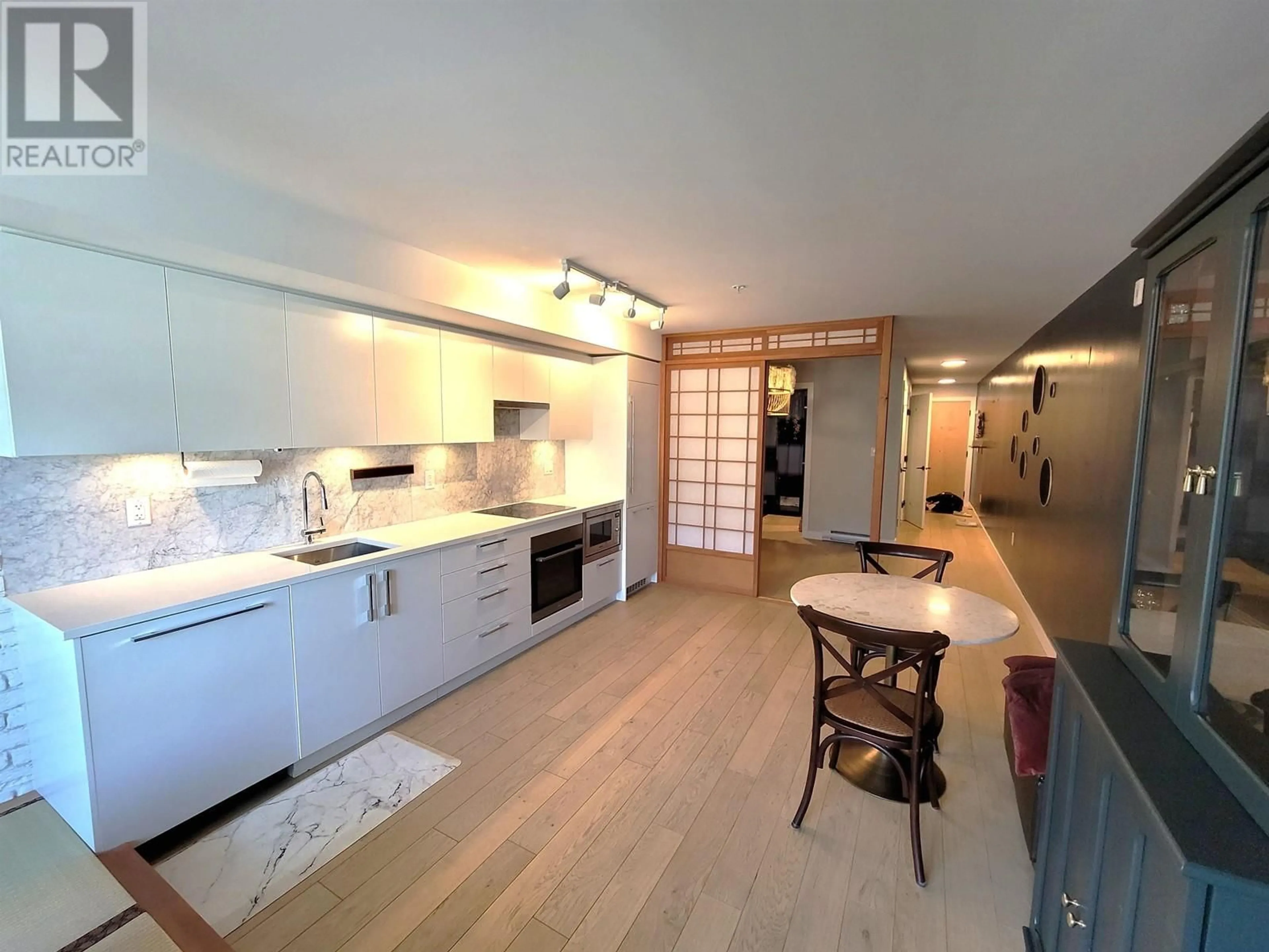 Open concept kitchen, unknown for 211 - 2508 FRASER STREET, Vancouver British Columbia V5T1T1