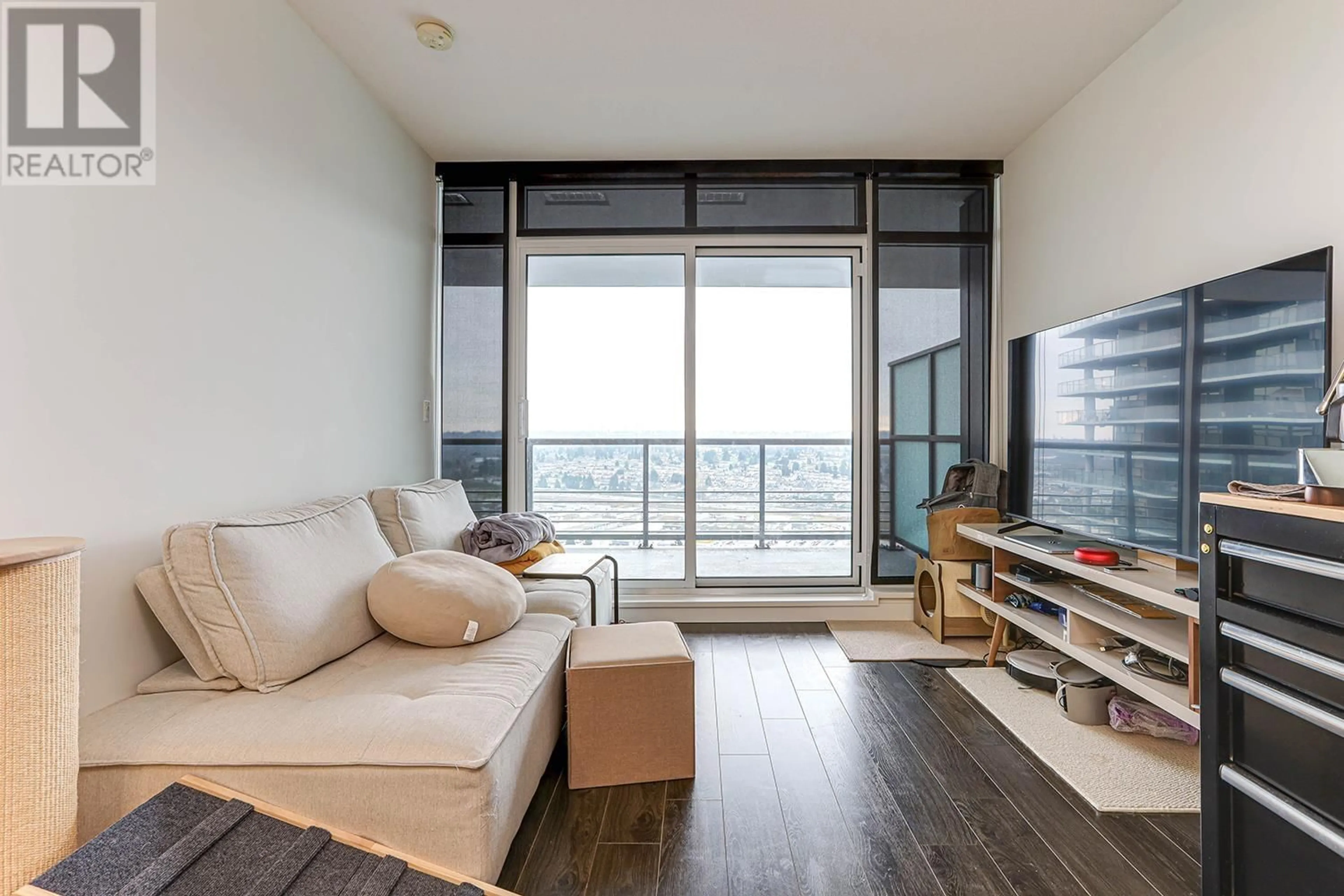 Living room with furniture, wood/laminate floor for 2912 - 4730 LOUGHEED HIGHWAY, Burnaby British Columbia V5C0M9