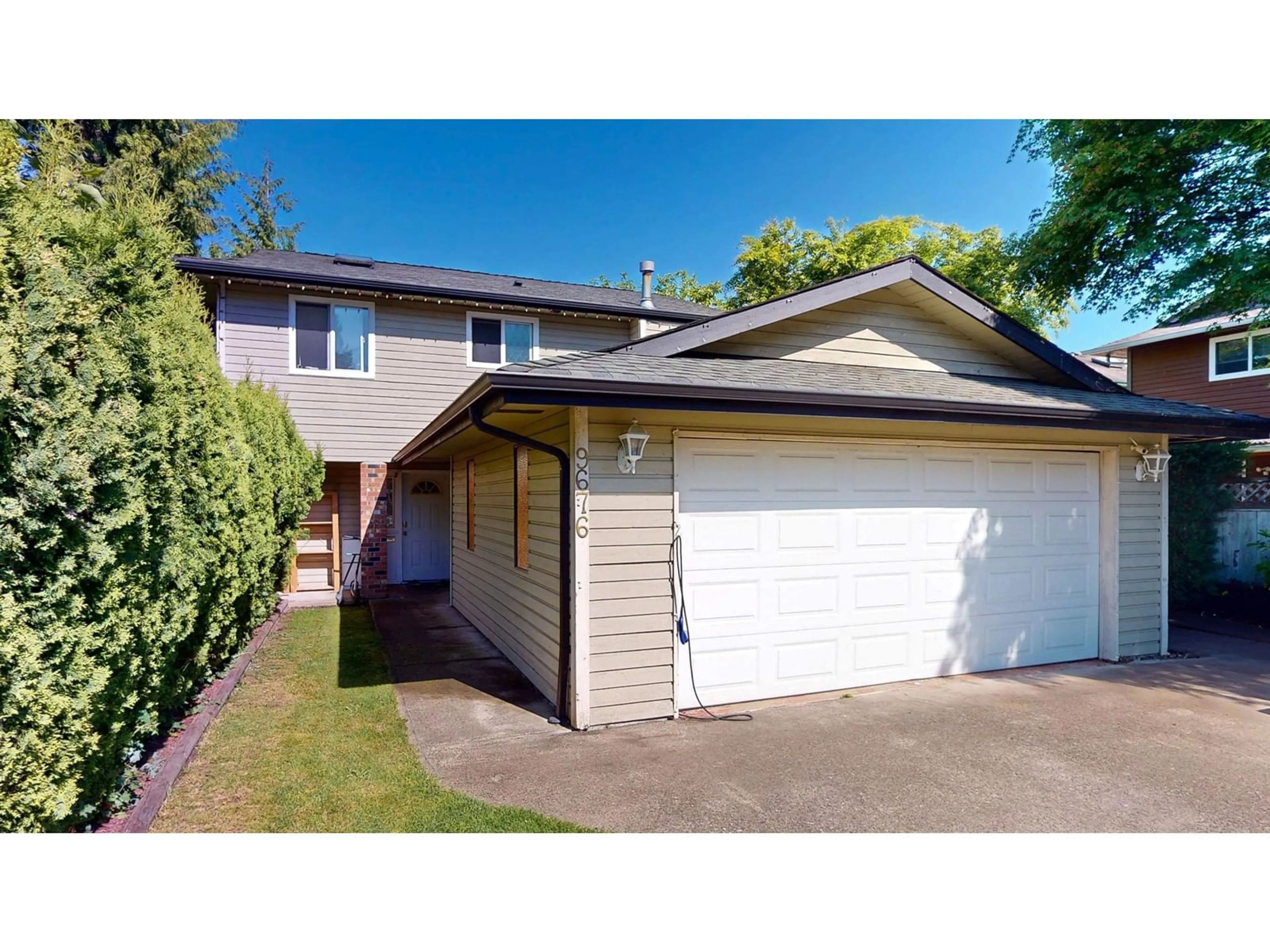 Home with vinyl exterior material, street for 9676 155B, Surrey British Columbia V3R7N9