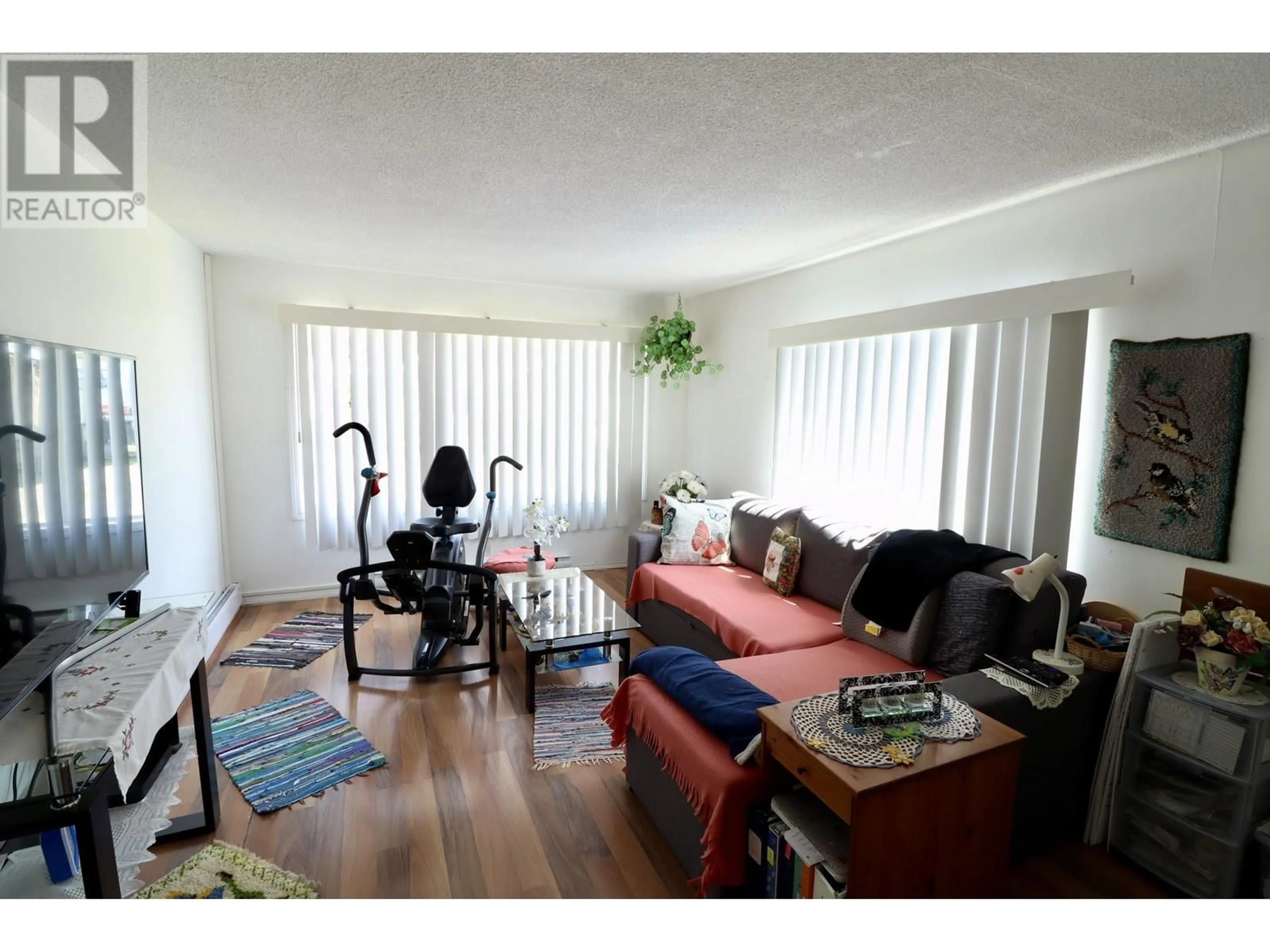 Living room with furniture, wood/laminate floor for 12A - 3730 LANSDOWNE ROAD, Prince George British Columbia V2N2S5