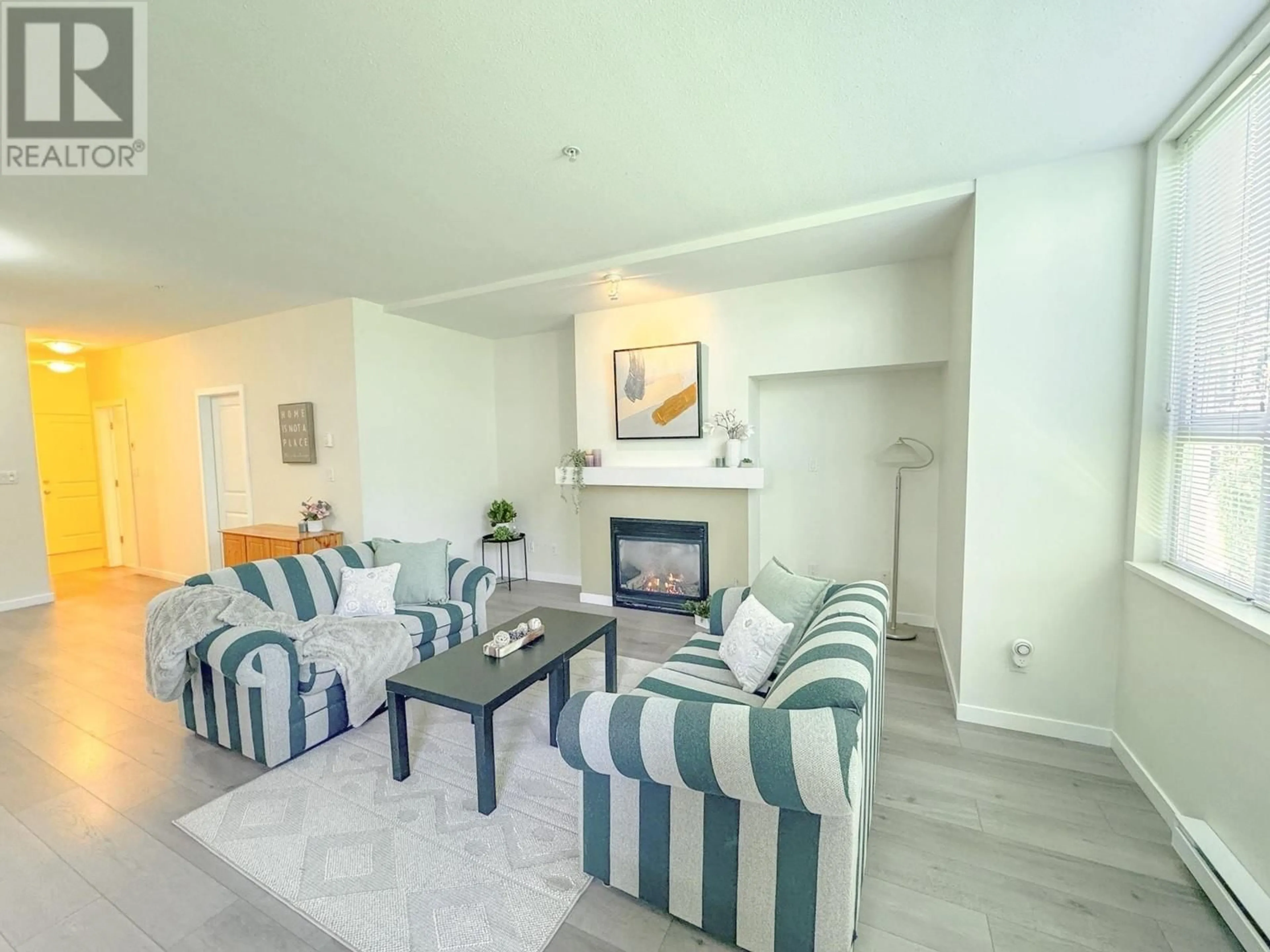 Living room with furniture, unknown for 104 - 7089 MONT ROYAL SQUARE, Vancouver British Columbia V5S4W6