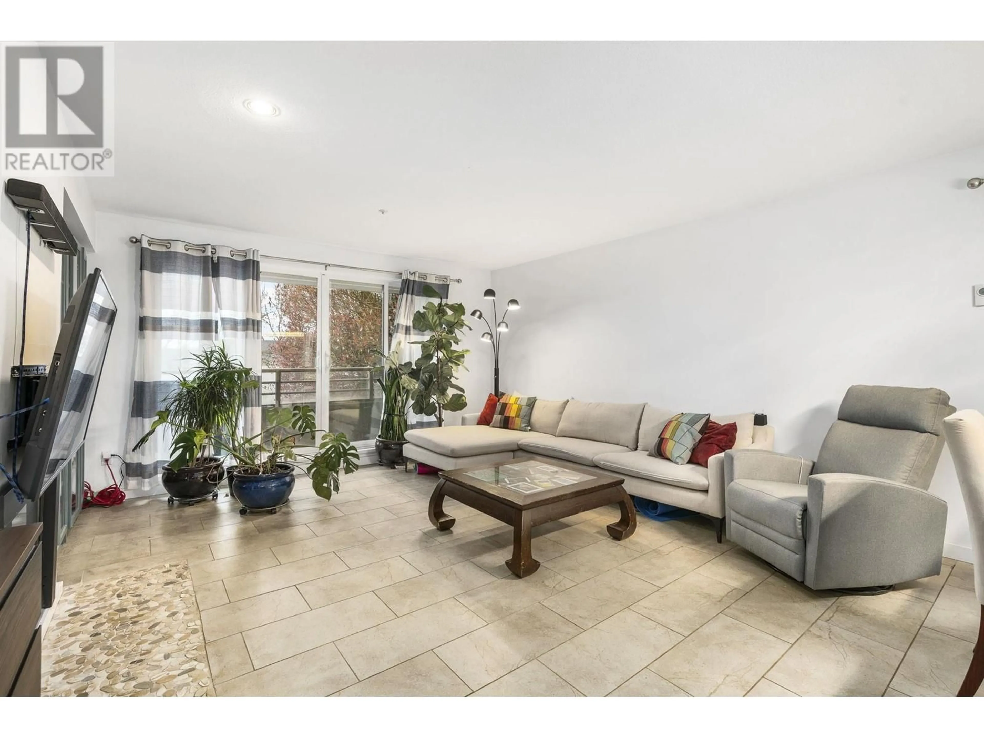 Living room with furniture, ceramic/tile floor for 1 - 2150 MARINE DRIVE, Vancouver British Columbia V5P2S1