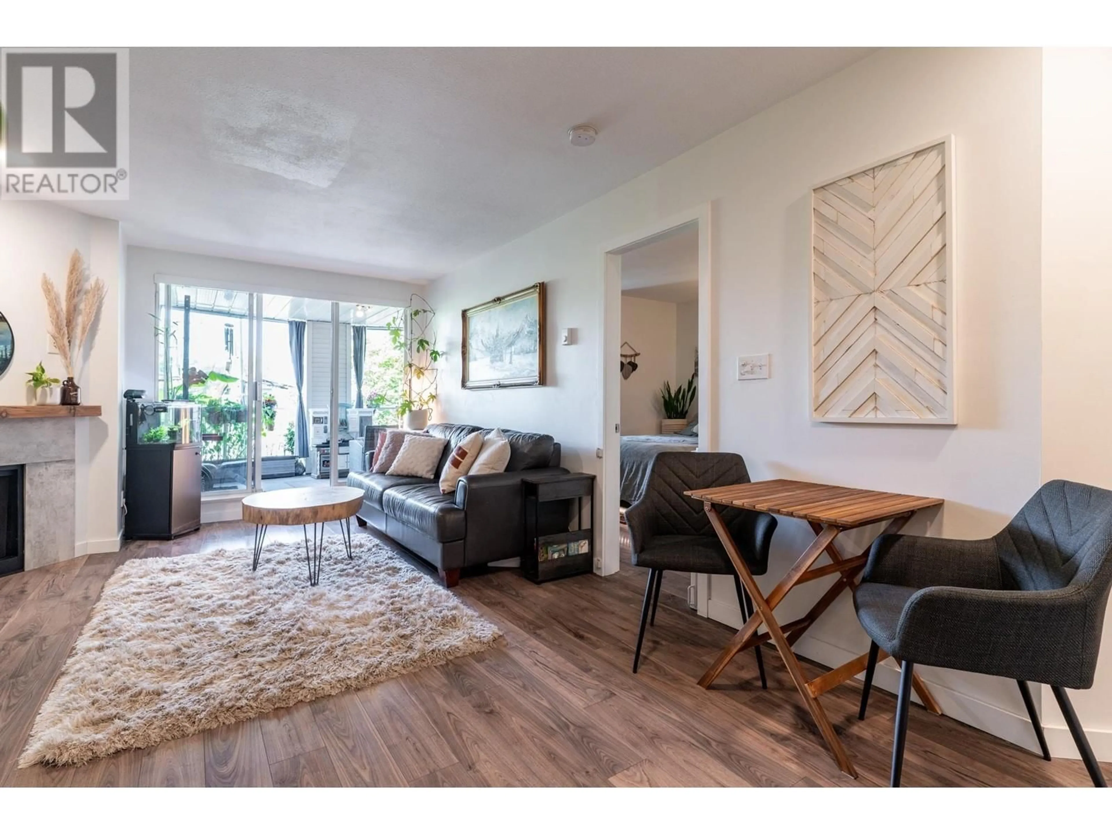 Living room with furniture, wood/laminate floor for 206 - 2339 SHAUGHNESSY STREET, Port Coquitlam British Columbia V3C3E2