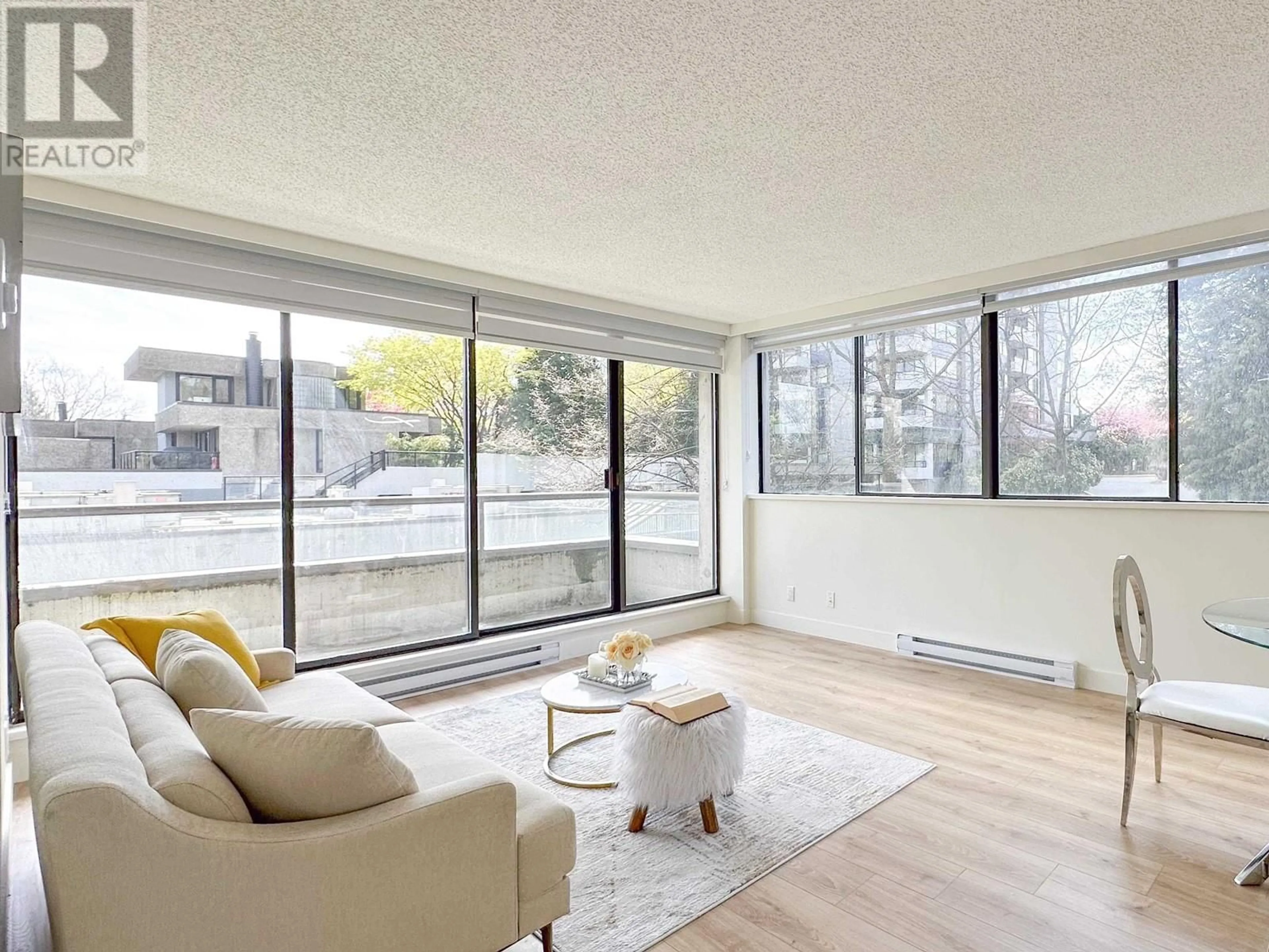 Living room with furniture, unknown for 204 - 3970 CARRIGAN COURT, Burnaby British Columbia V3N4S5