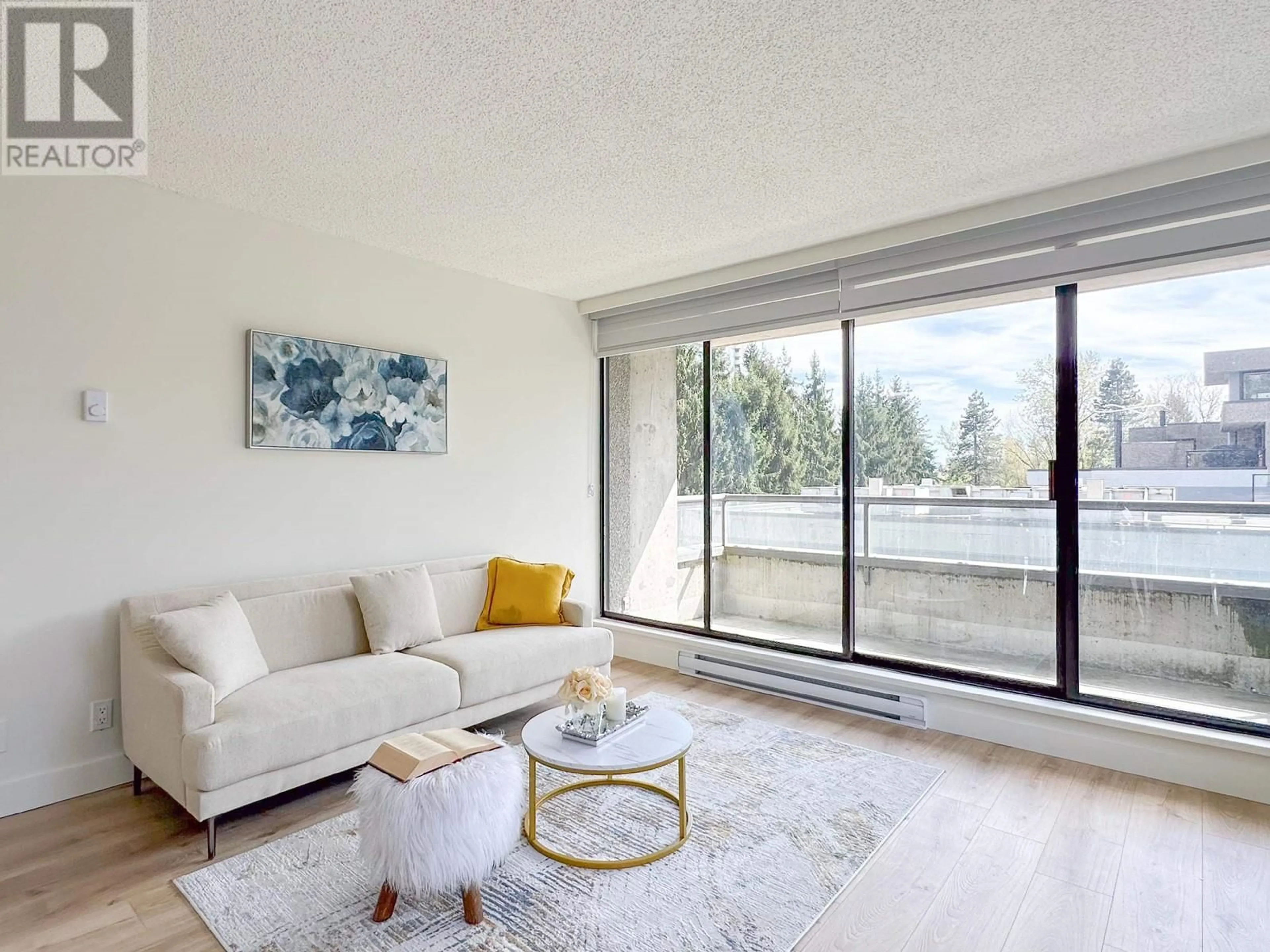 Living room with furniture, unknown for 204 - 3970 CARRIGAN COURT, Burnaby British Columbia V3N4S5