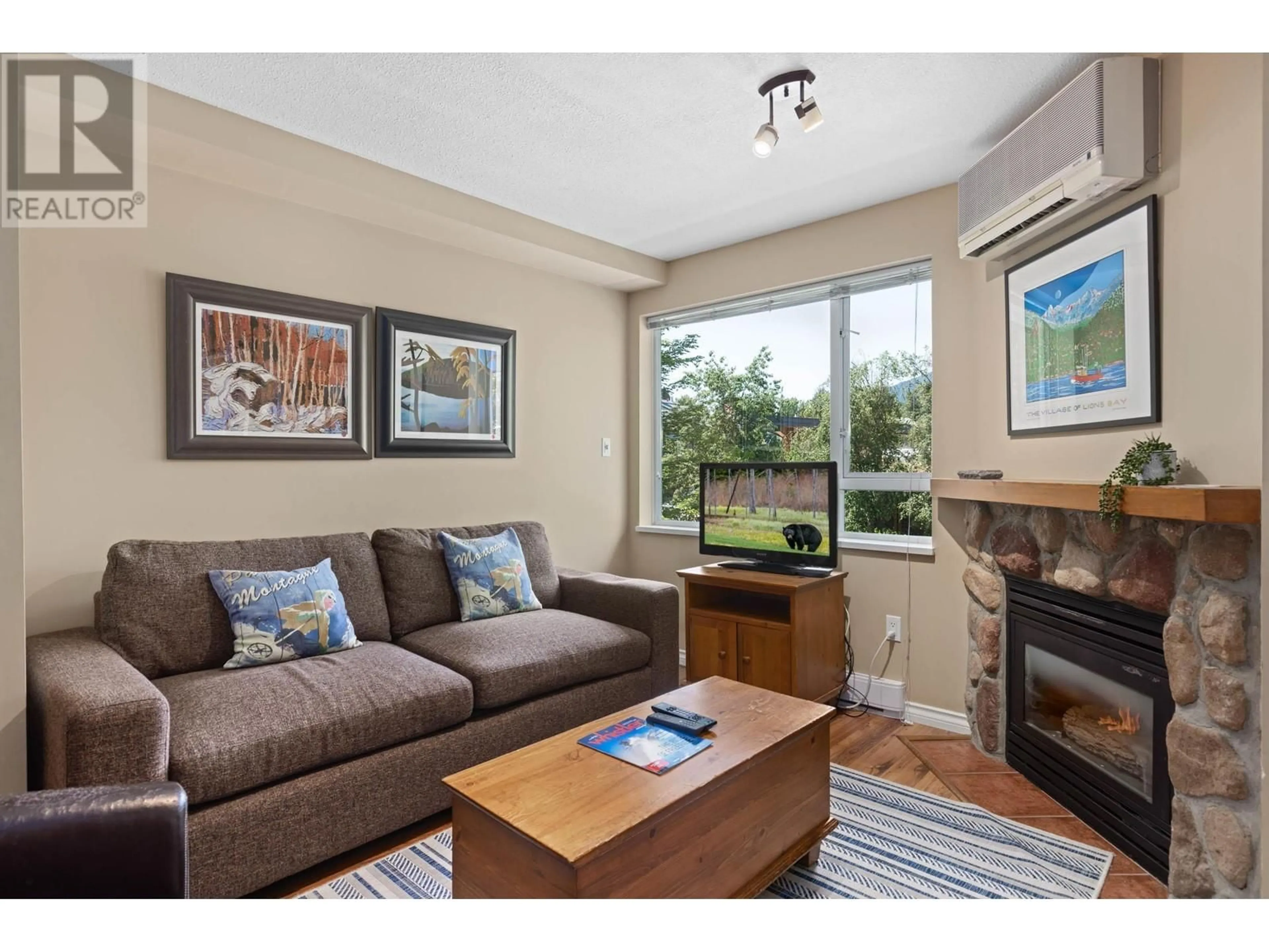 Living room with furniture, wood/laminate floor for 251 - 4314 MAIN STREET, Whistler British Columbia V8E1A8