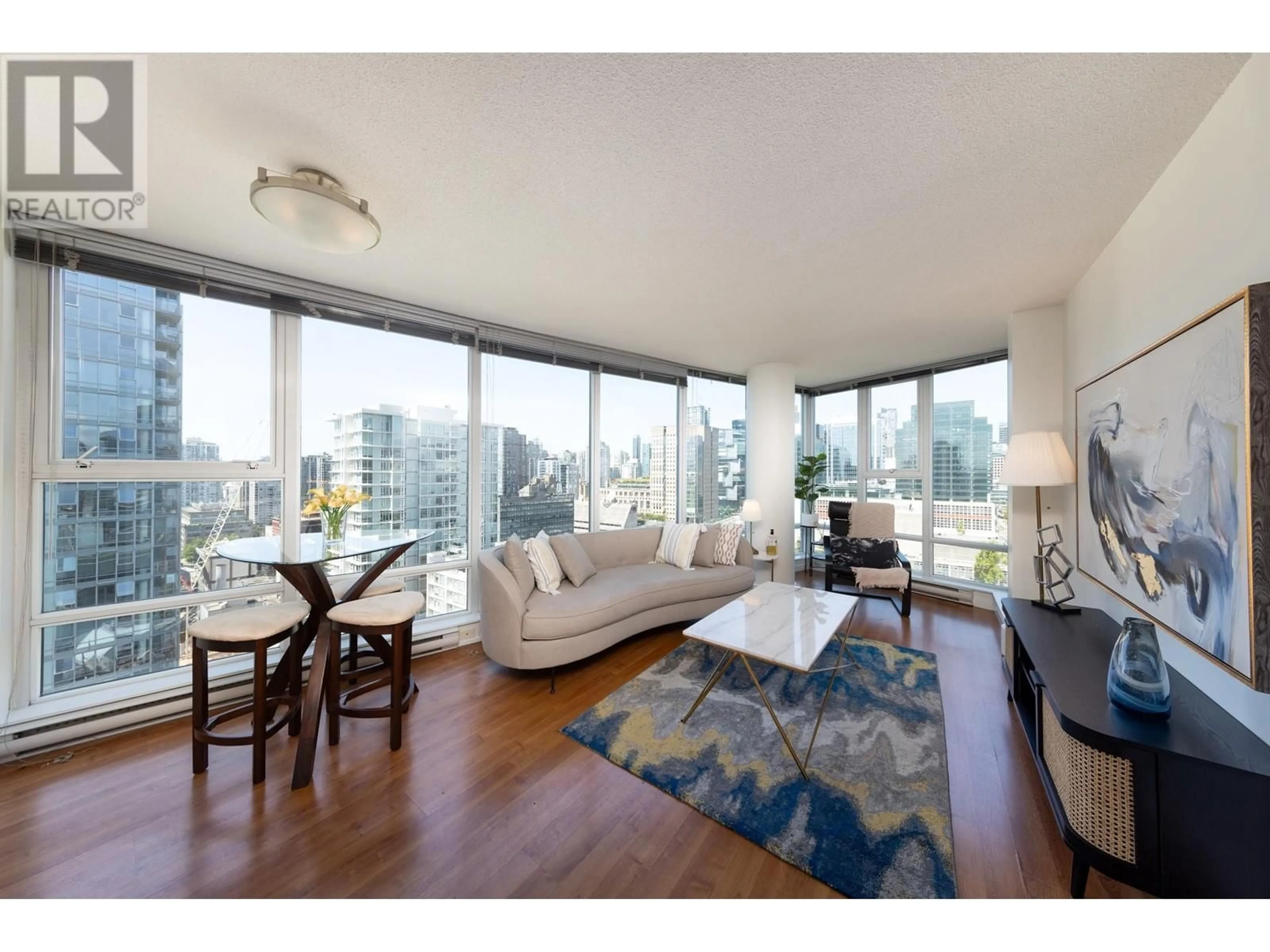 Living room with furniture, wood/laminate floor for 2203 - 602 CITADEL PARADE, Vancouver British Columbia V6B1X2