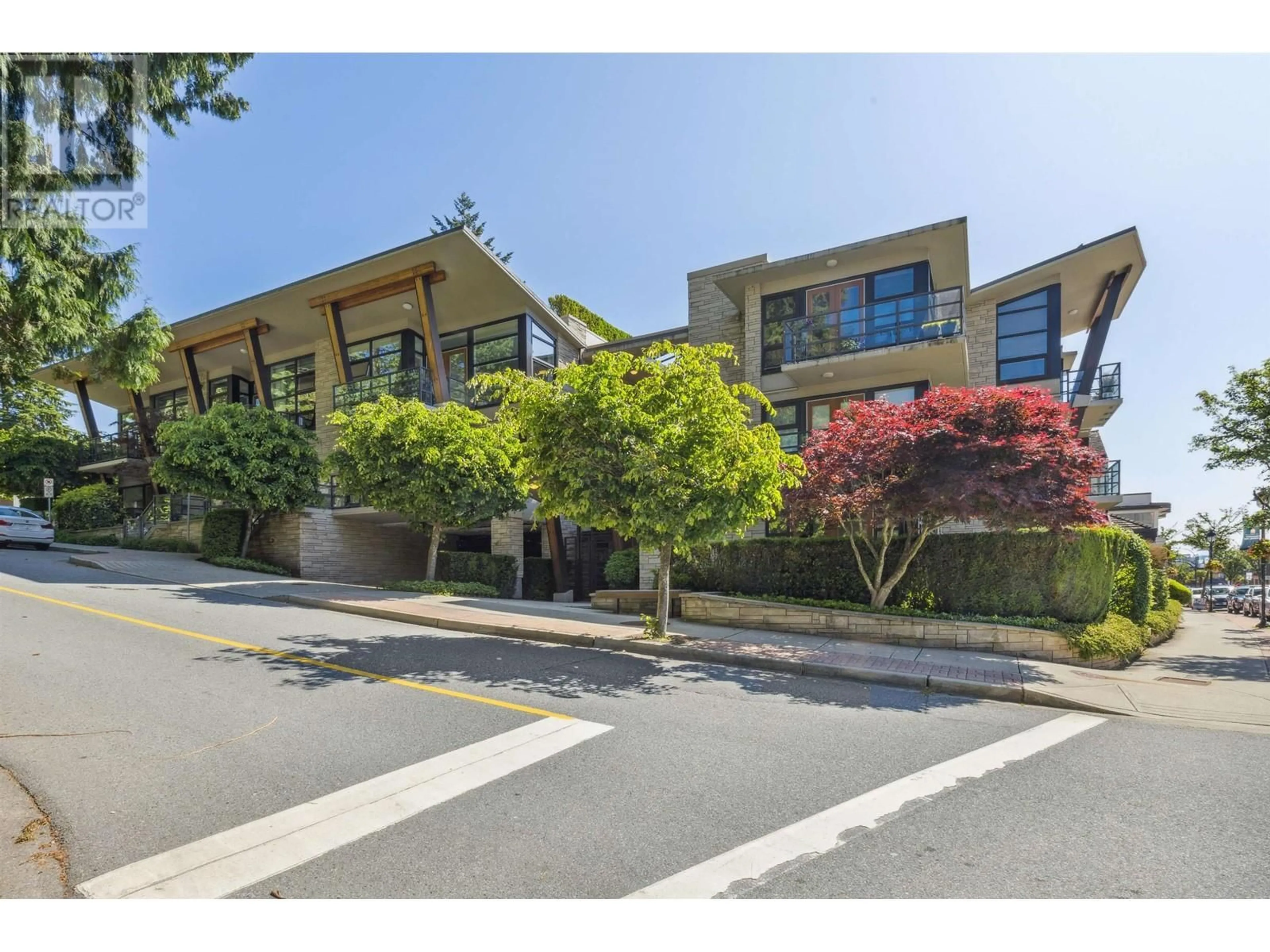 A pic from outside/outdoor area/front of a property/back of a property/a pic from drone, street for 10 - 1891 MARINE DRIVE, West Vancouver British Columbia V7V1J7