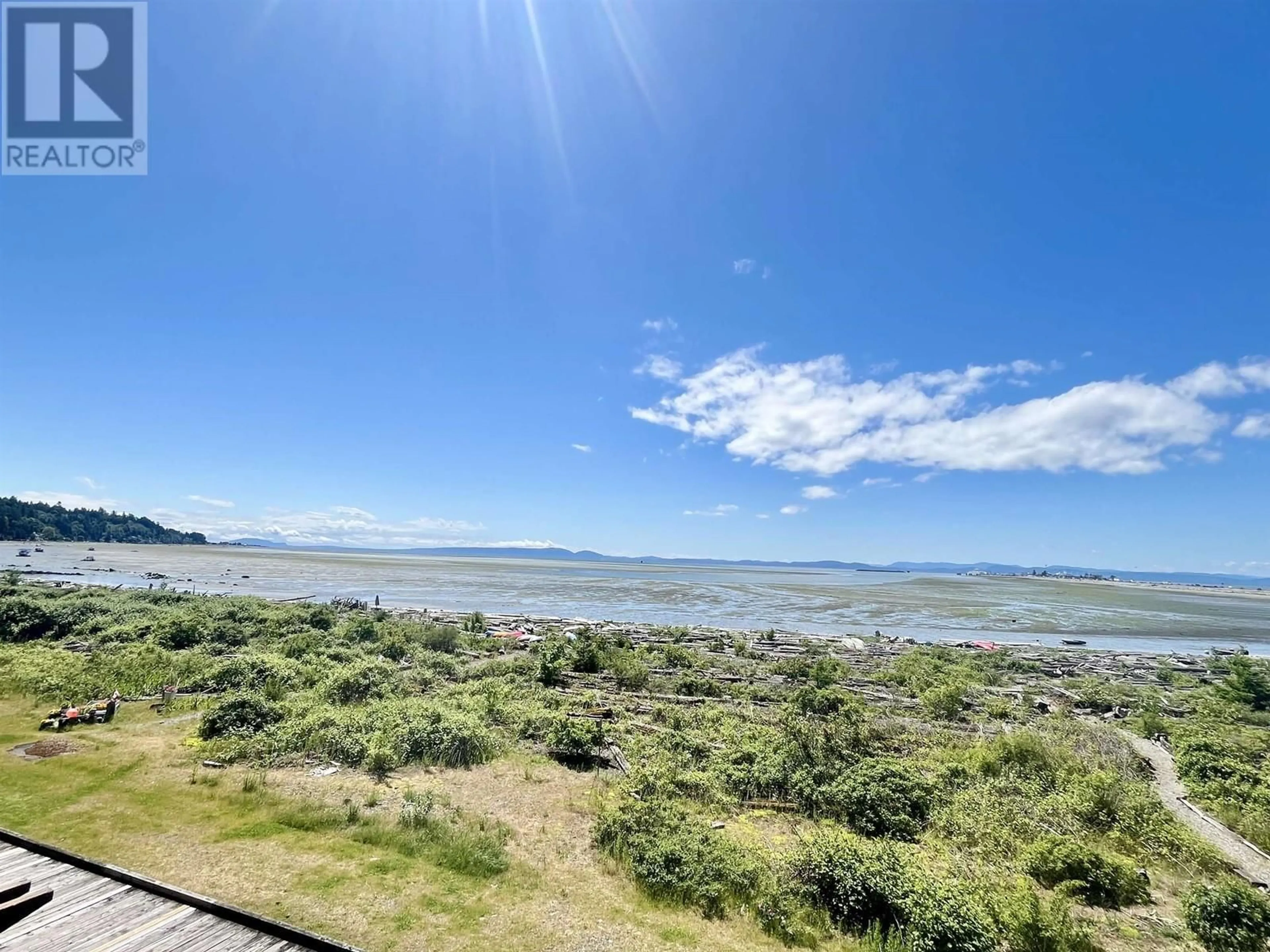 A pic from outside/outdoor area/front of a property/back of a property/a pic from drone, water/lake/river/ocean view for 207 - 1120 TSATSU SHORES DRIVE, Tsawwassen British Columbia V4M4G3