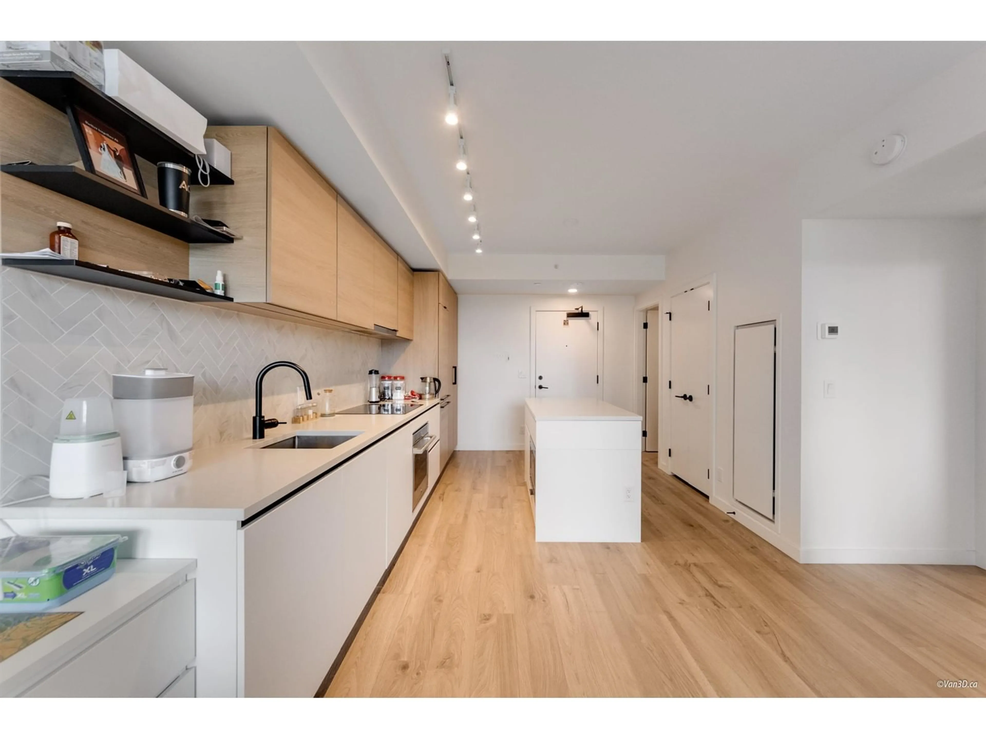 Open concept kitchen, wood/laminate floor for 506 - 10448 UNIVERSITY, Surrey British Columbia V3T0S7