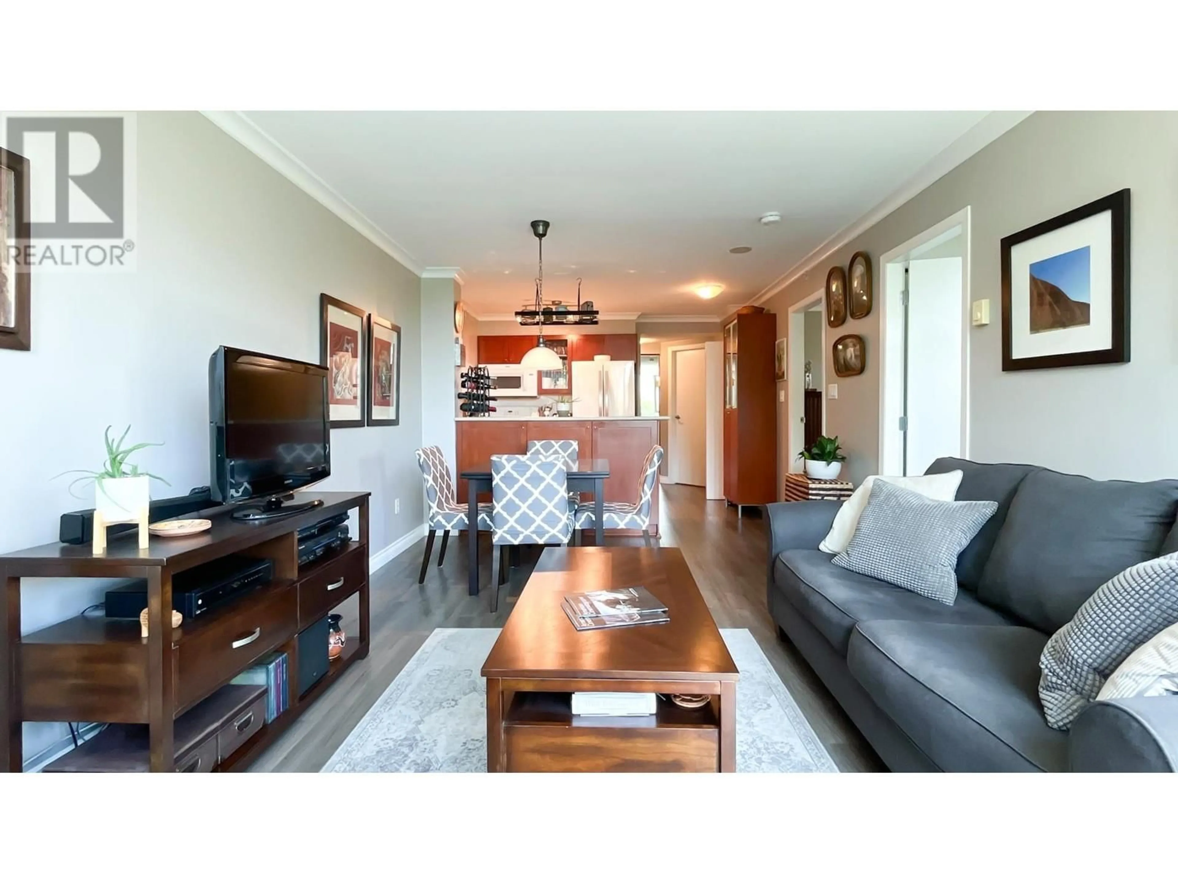 Living room with furniture, wood/laminate floor for 206 - 2733 CHANDLERY PLACE, Vancouver British Columbia V5S4V3