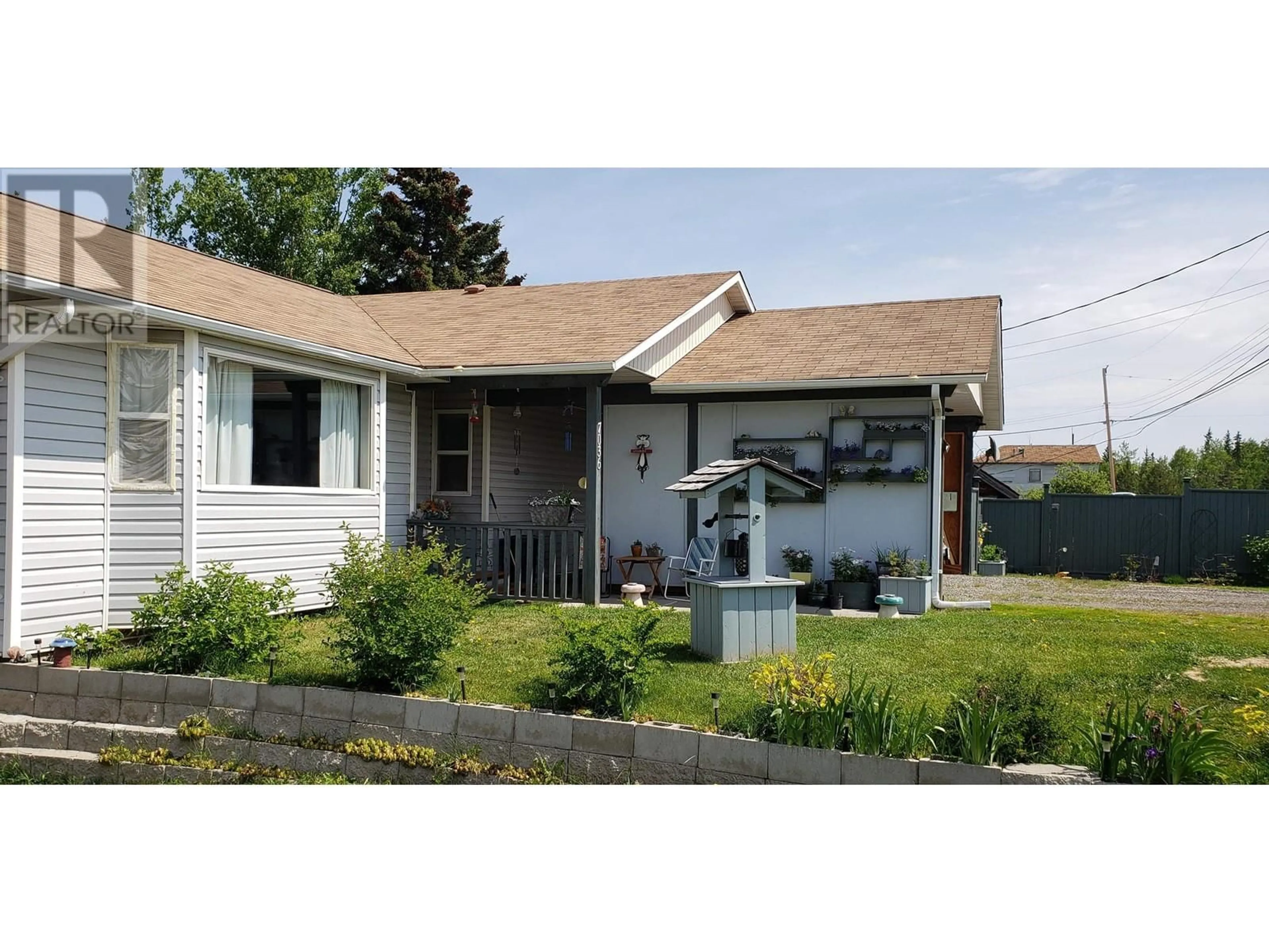 Home with vinyl exterior material, street for 7036 93 MILE FRONTAGE ROAD, 100 Mile House British Columbia V0K2E2