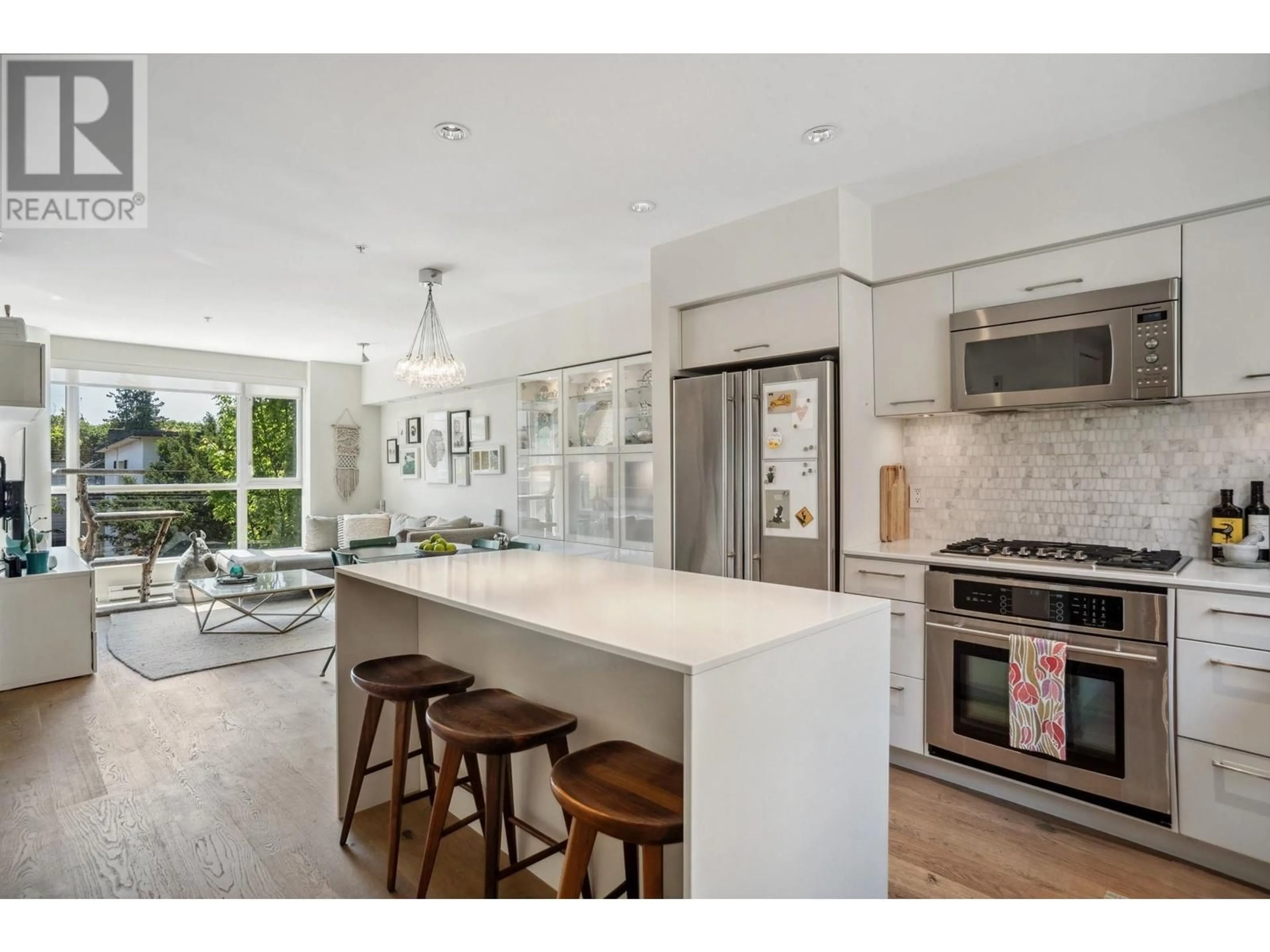 Open concept kitchen, ceramic/tile floor for 207 - 1961 COLLINGWOOD STREET, Vancouver British Columbia V6R3K6