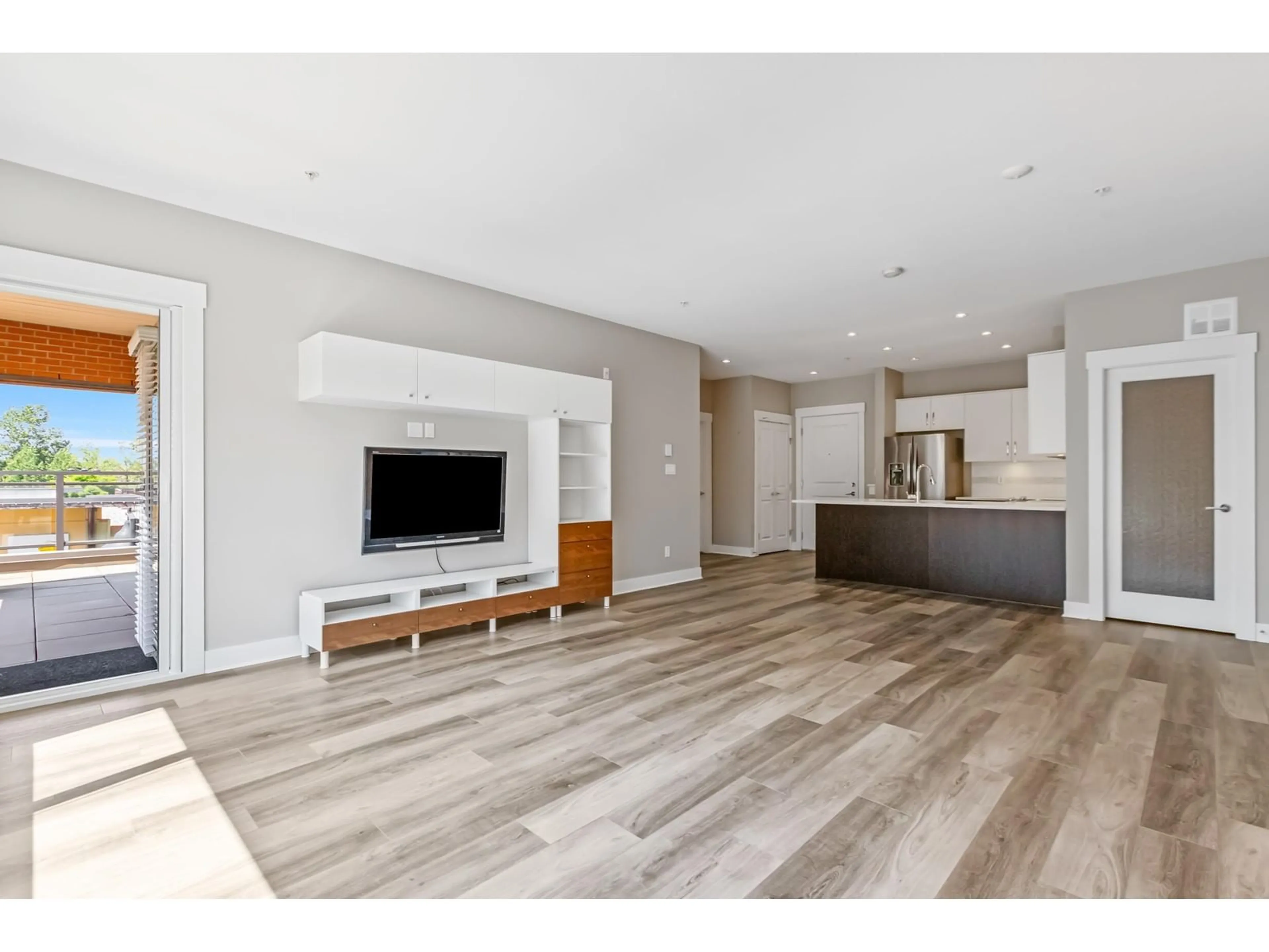 Open concept kitchen, wood/laminate floor for 219 - 20728 WILLOUGHBY TOWN CENTRE, Langley British Columbia V2Y0P3