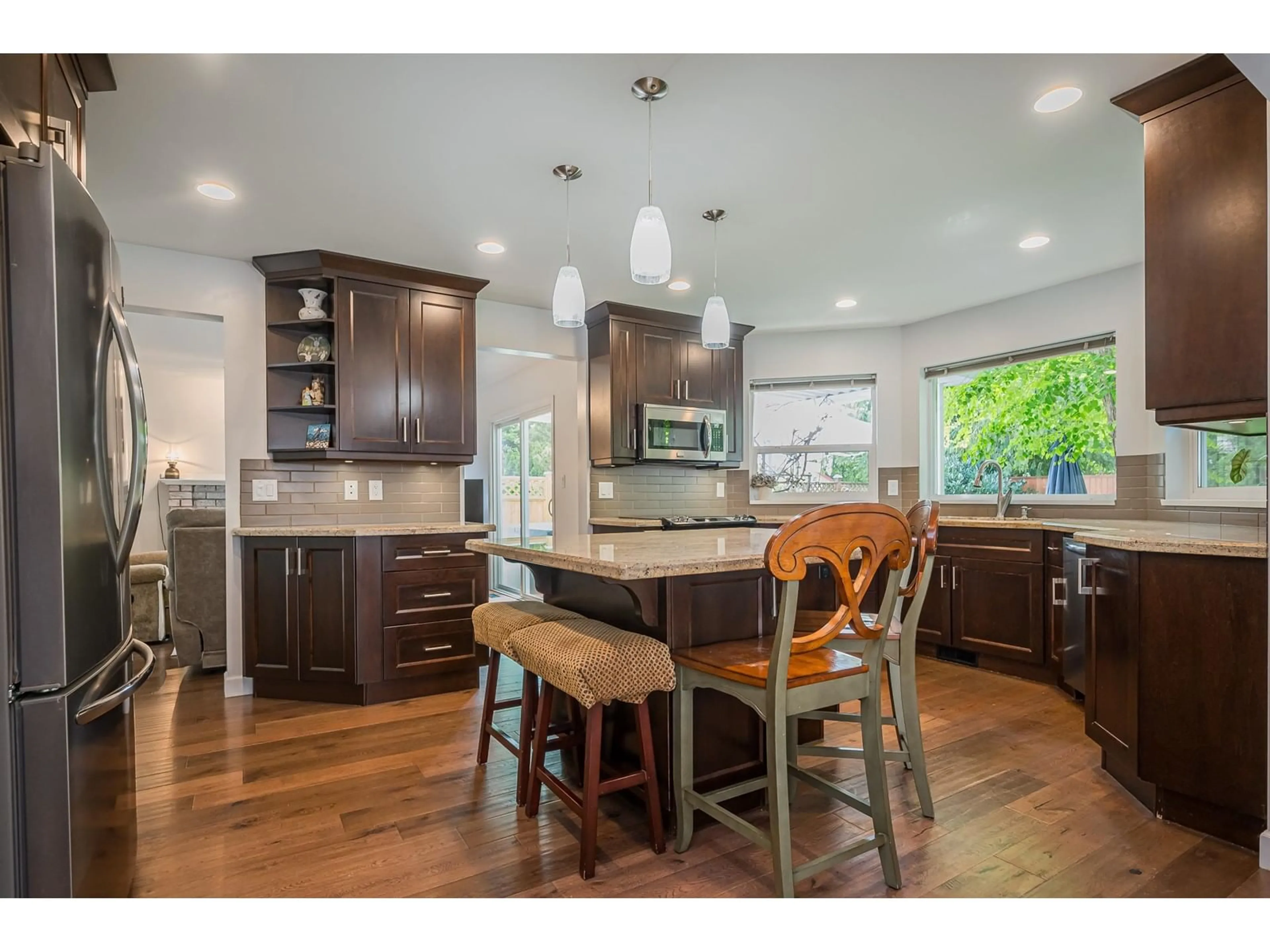 Open concept kitchen, wood/laminate floor for 20290 94A, Langley British Columbia V1M1G2