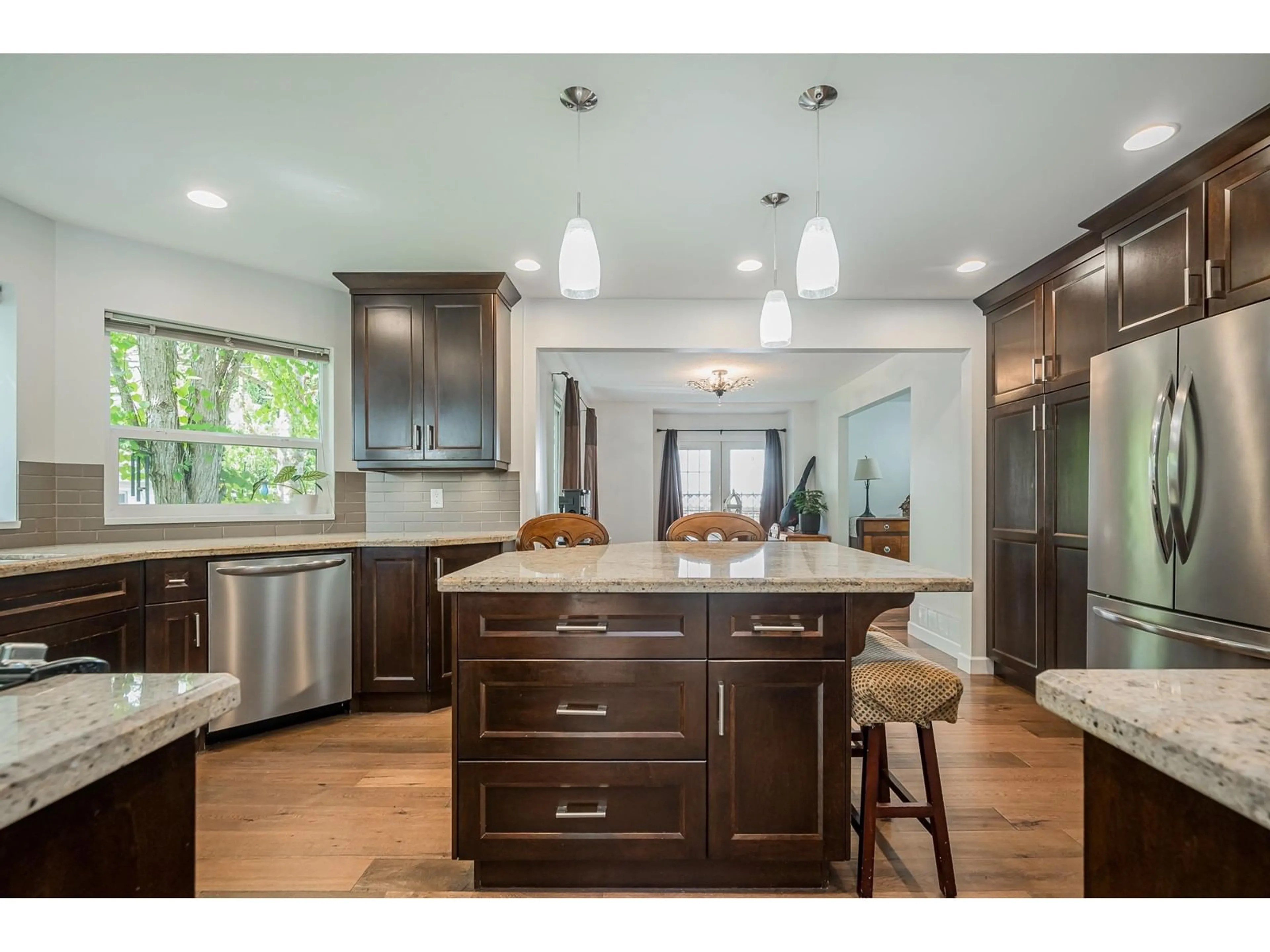 Open concept kitchen, wood/laminate floor for 20290 94A, Langley British Columbia V1M1G2