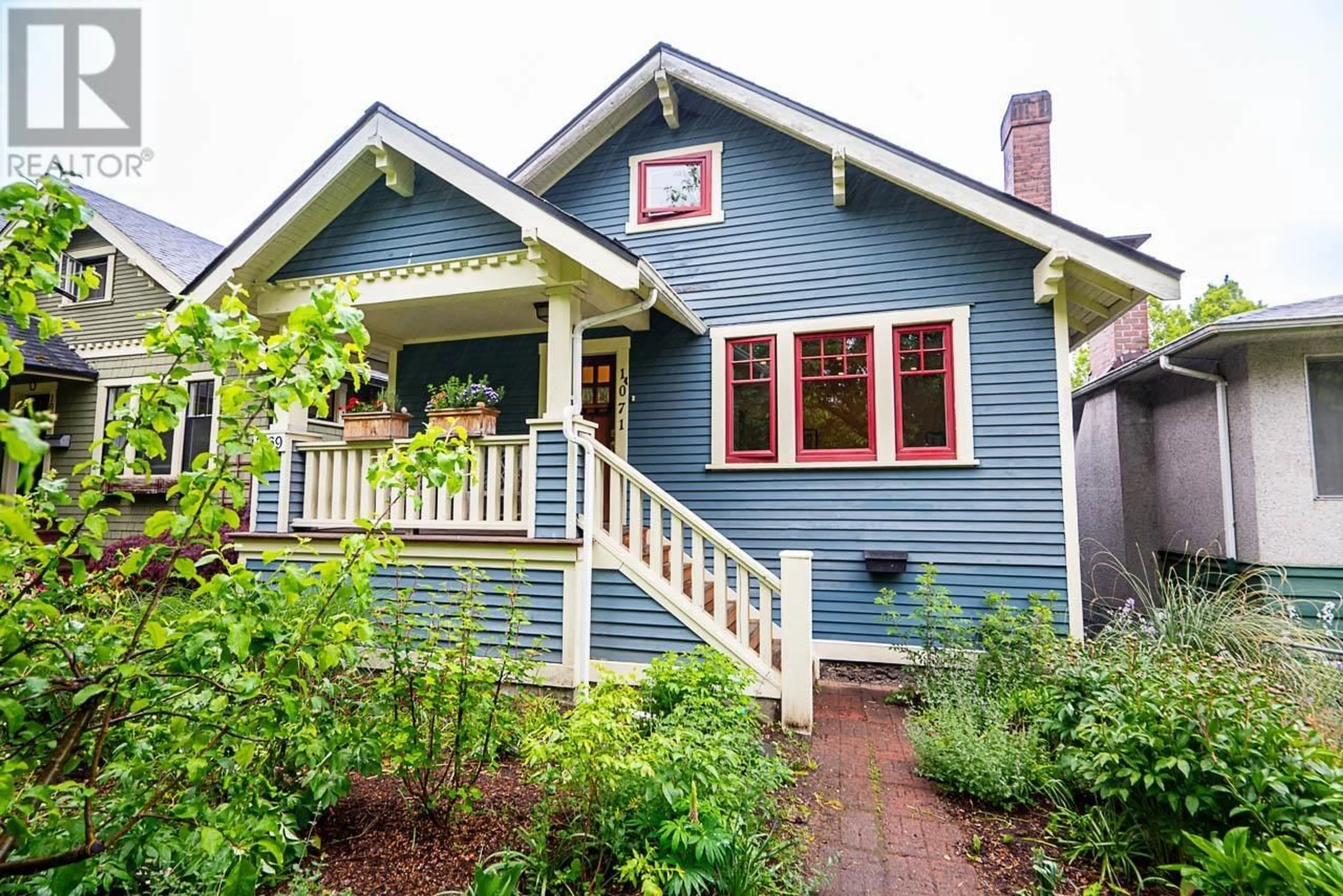 Home with vinyl exterior material, street for 1071 10TH AVENUE, Vancouver British Columbia V5T2B4